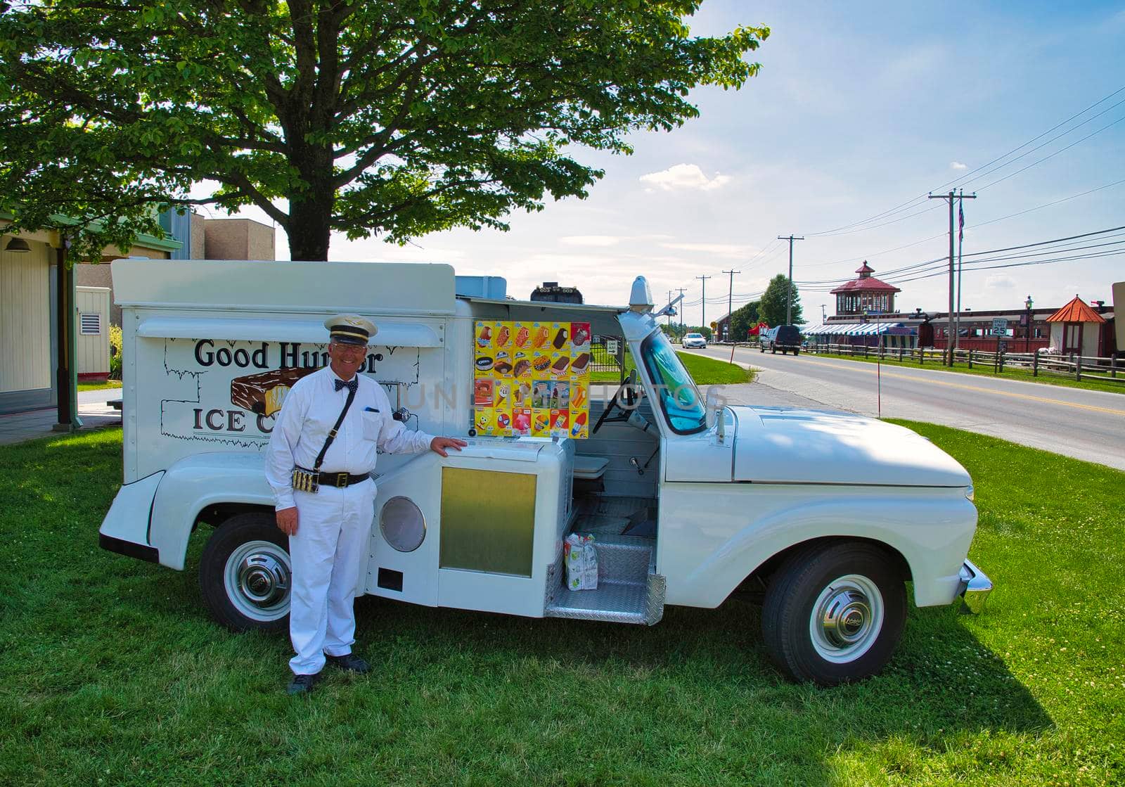 Strasburg, Pennsylvania, June 2018 - Old Restored Good Humor Ice Cream Truck and Owner Parked on Grass Selling Ice Cream