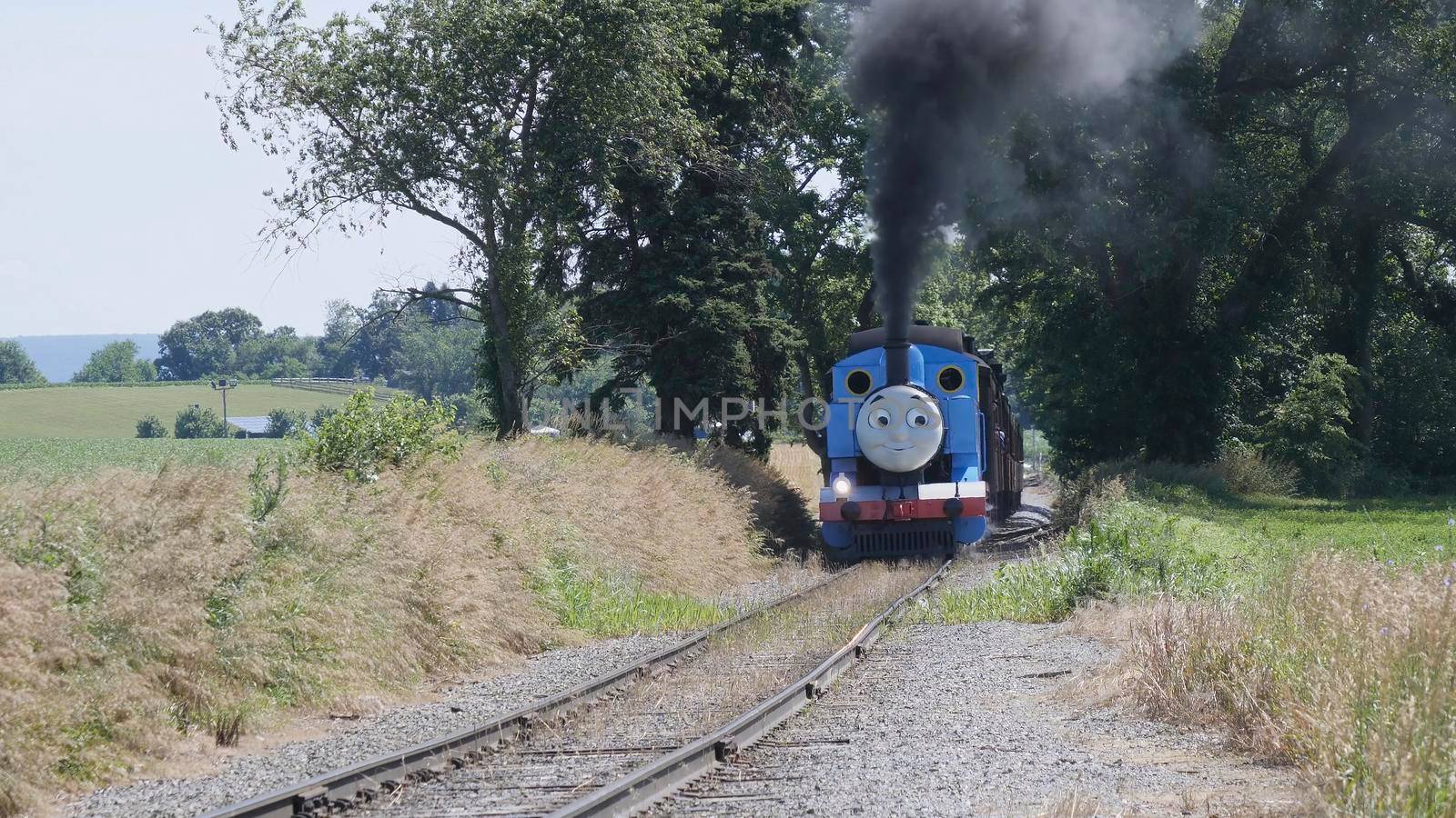 Ronks, Pennsylvania, June 2019 - Aerial View of Thomas the Tank Engine Puffing and Steaming along the Countryside