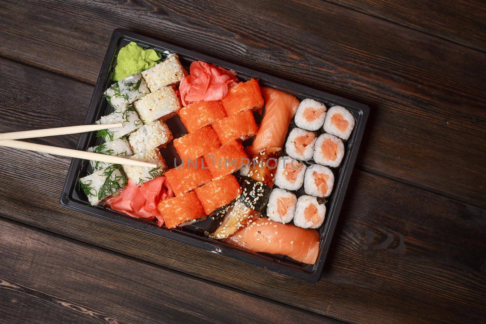asian food sushi and roll set wooden sticks seafood. High quality photo