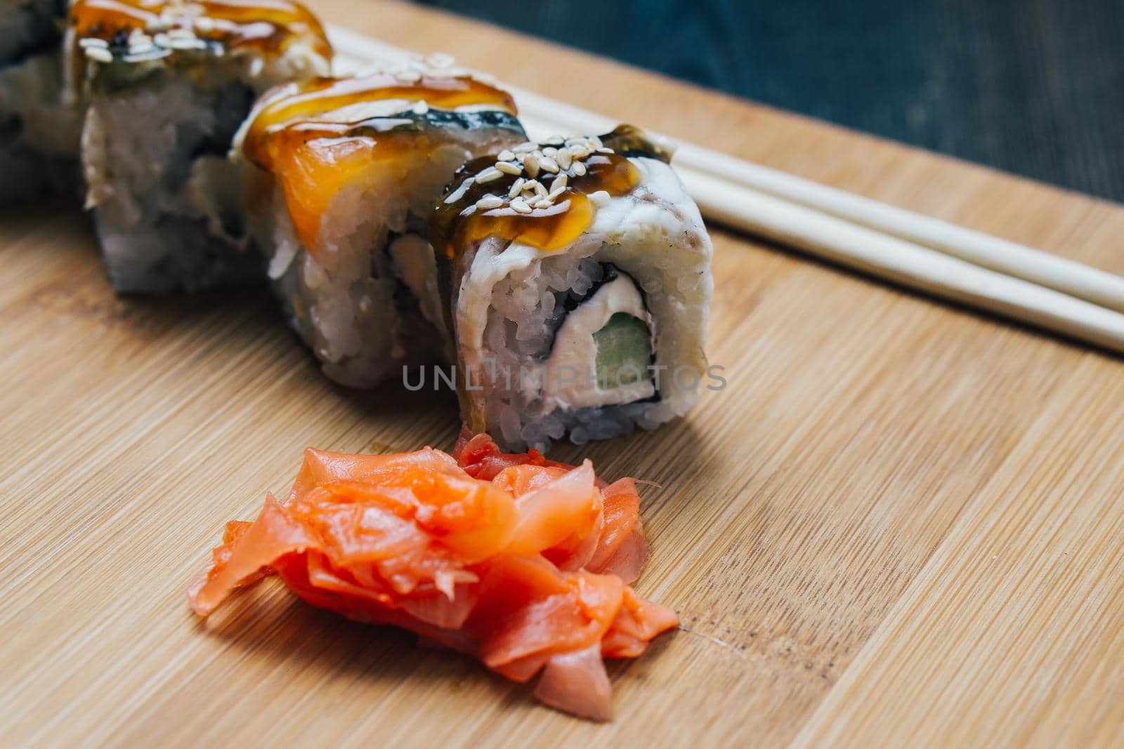 ginger sushi chopsticks wood board japanese cuisine restaurant snack. High quality photo