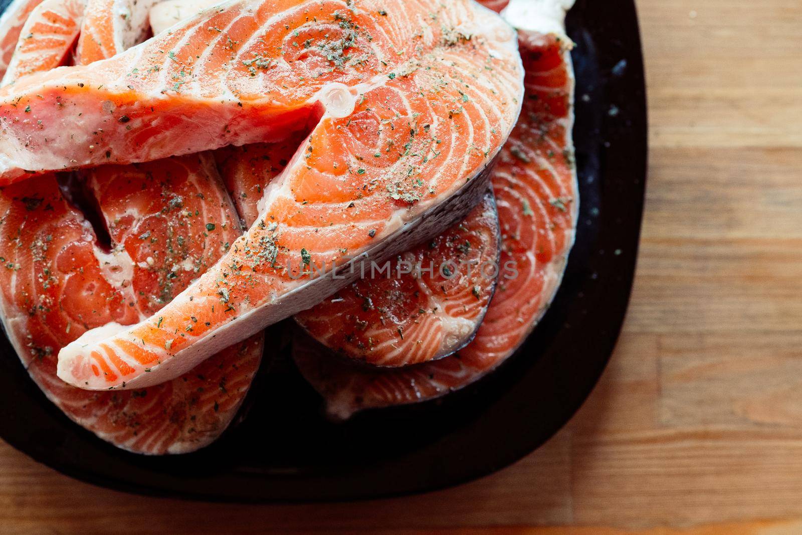 red fish on a plate steaks marinated in spices sea food. High quality photo