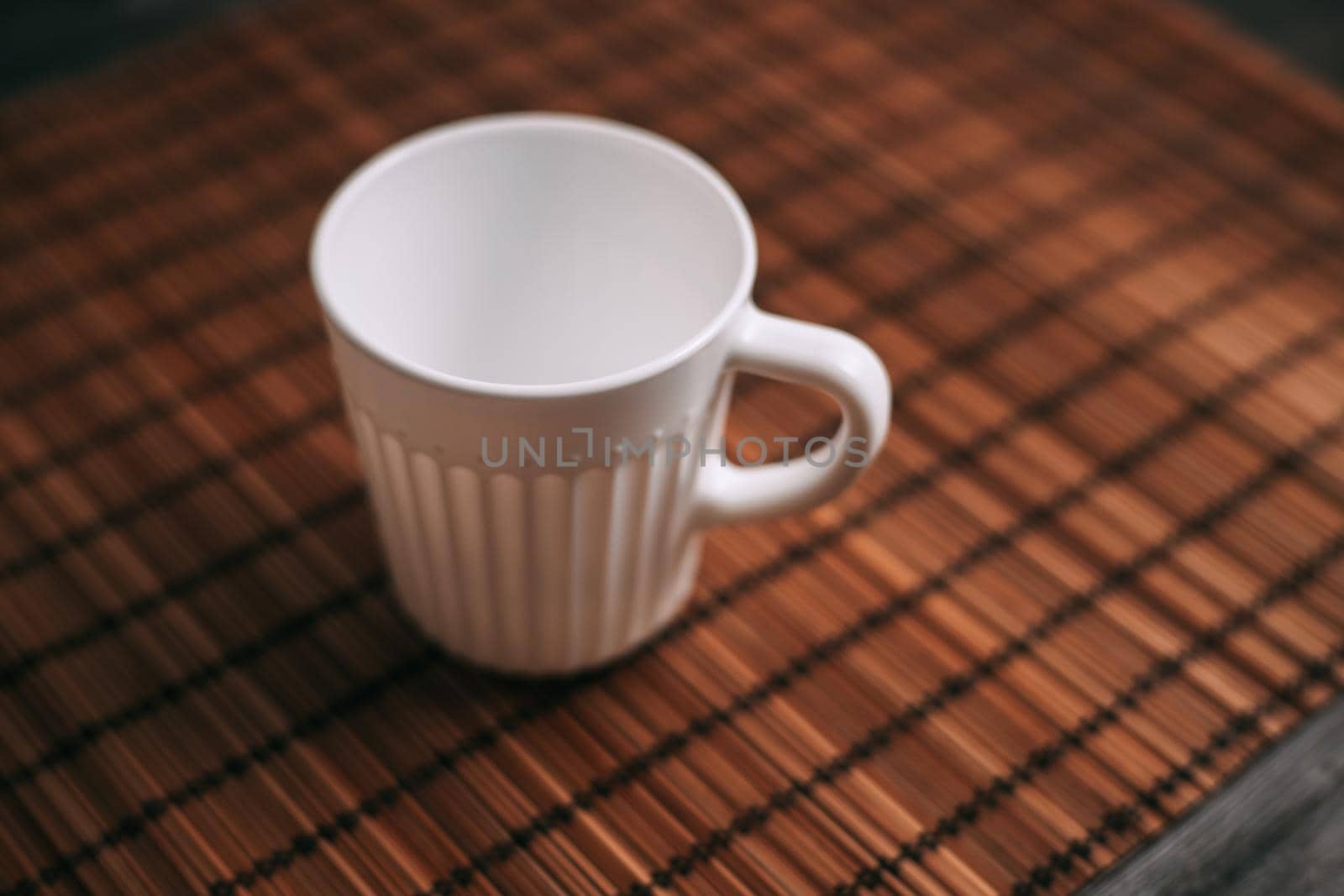 white mug on the table indoors stand texture top view. High quality photo