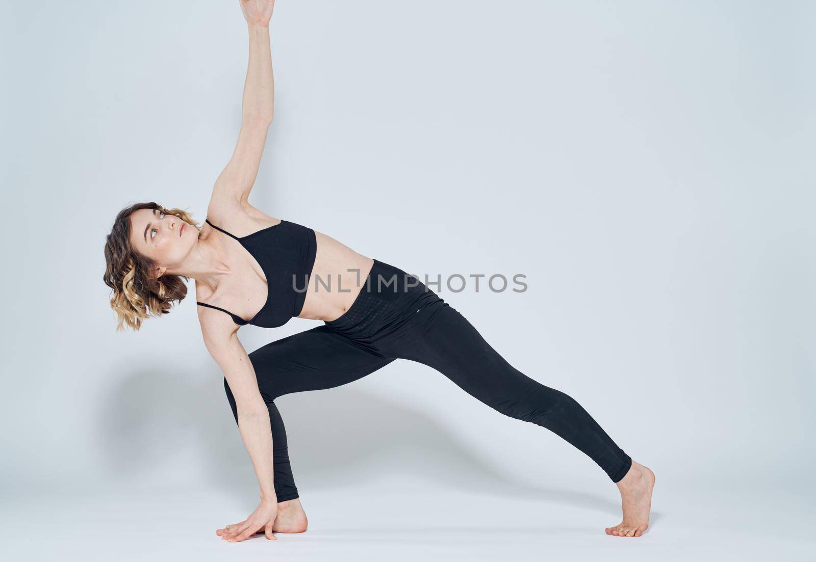 Yoga lunges forward right leg woman sport gymnastics by SHOTPRIME