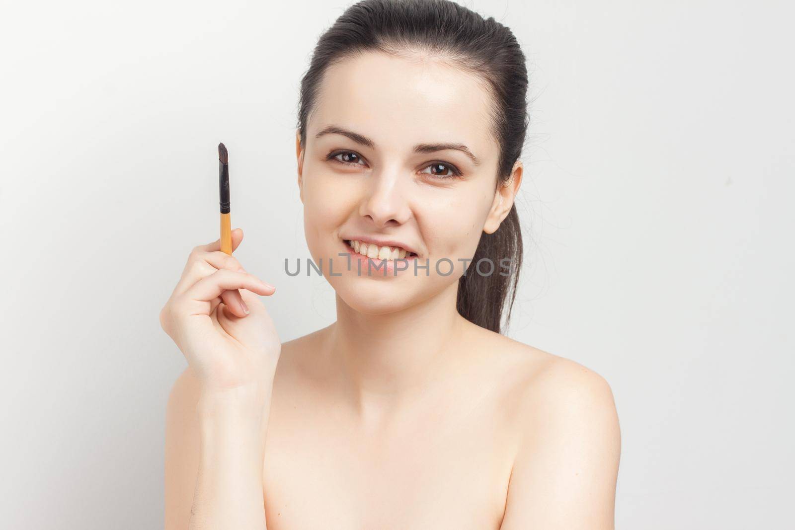 pretty woman naked shoulders cosmetics skin care. High quality photo