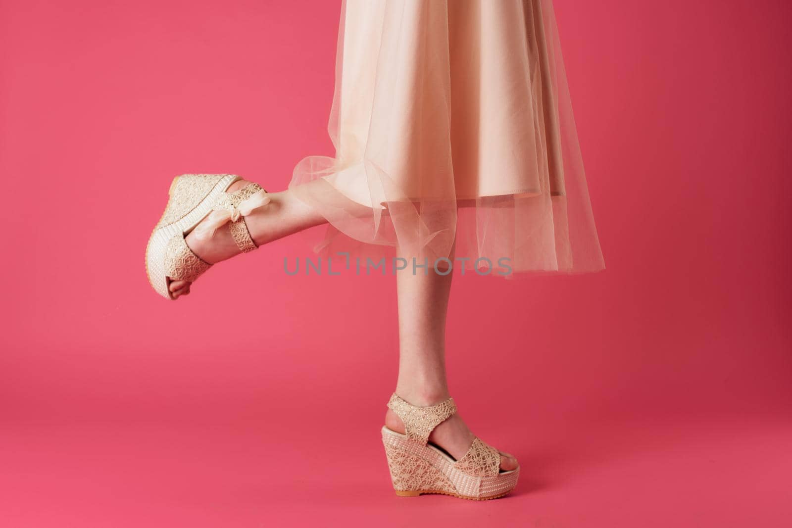 female feet attractive look fashion elegant style pink background. High quality photo