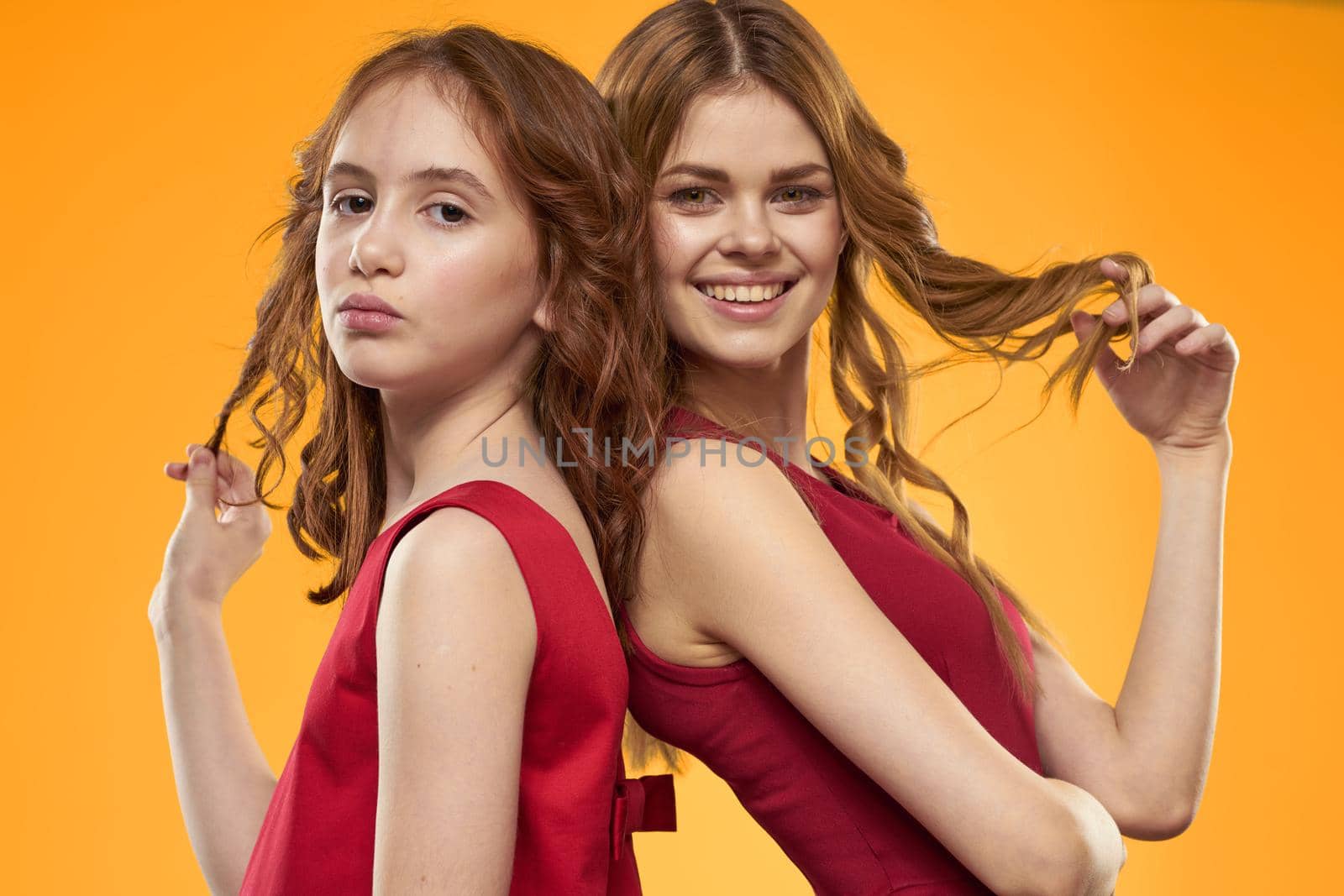 Family fun friendship emotions lifestyle yellow background. High quality photo