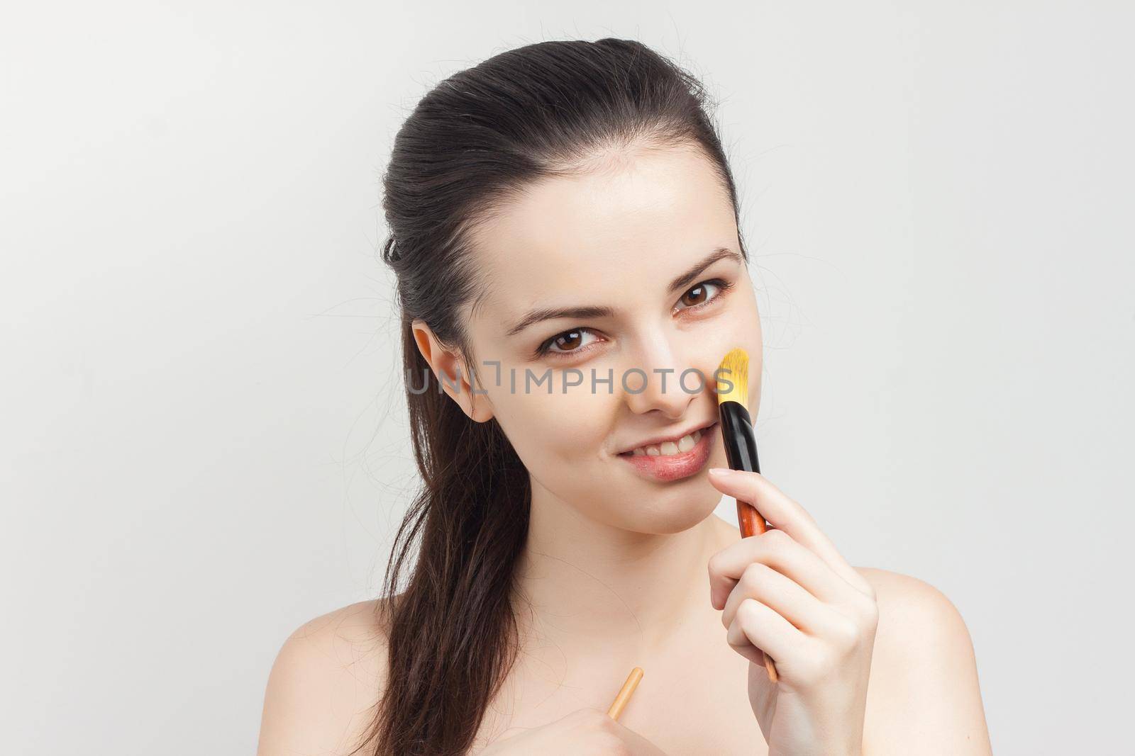 pretty woman naked shoulders cosmetics skin care. High quality photo