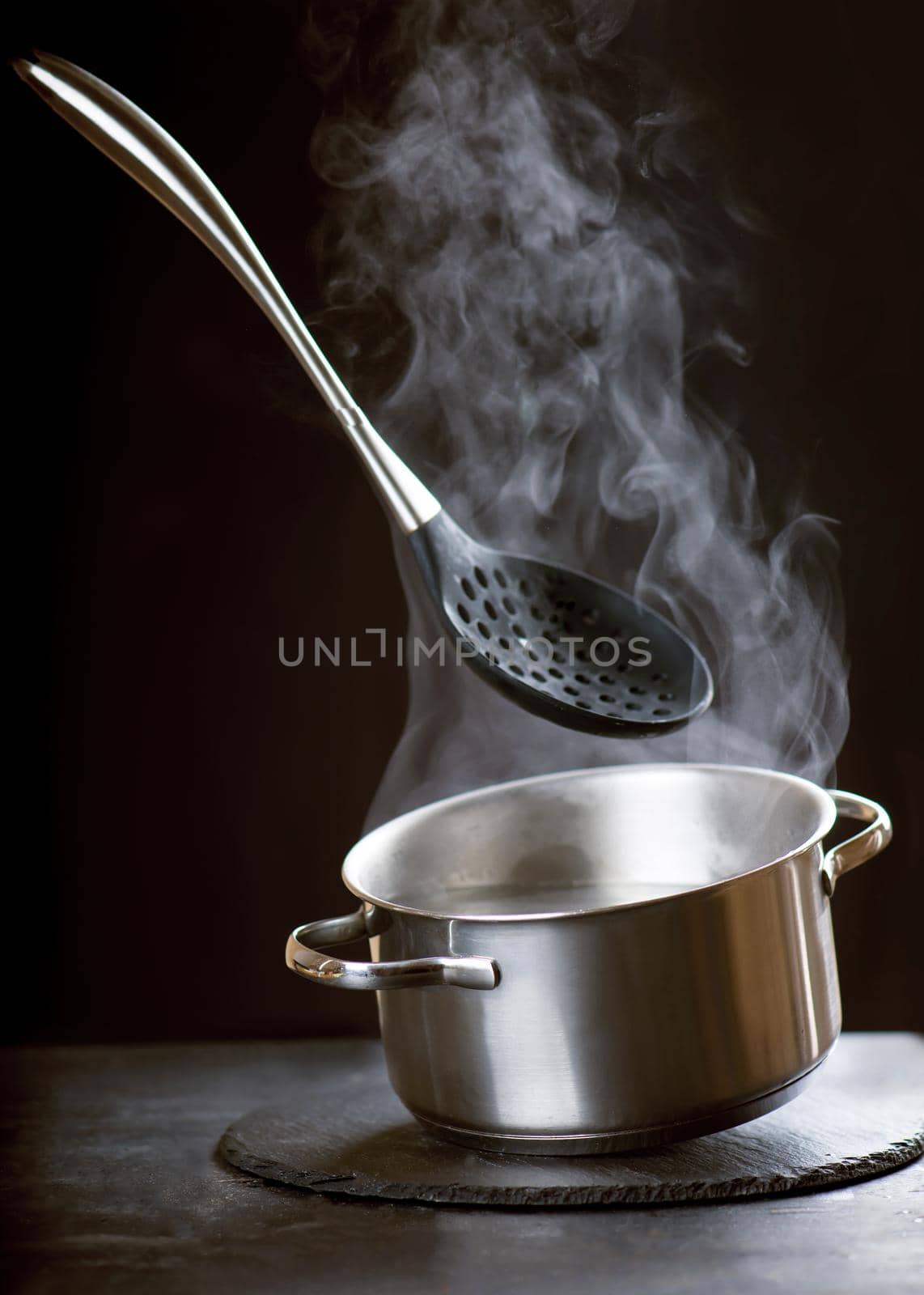 Bubbling water in a pan. Abstract background