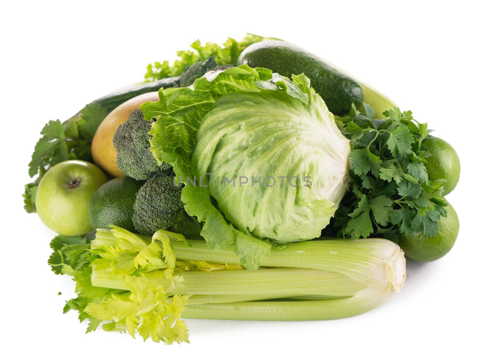 green fruits and vegetables on white background . by aprilphoto