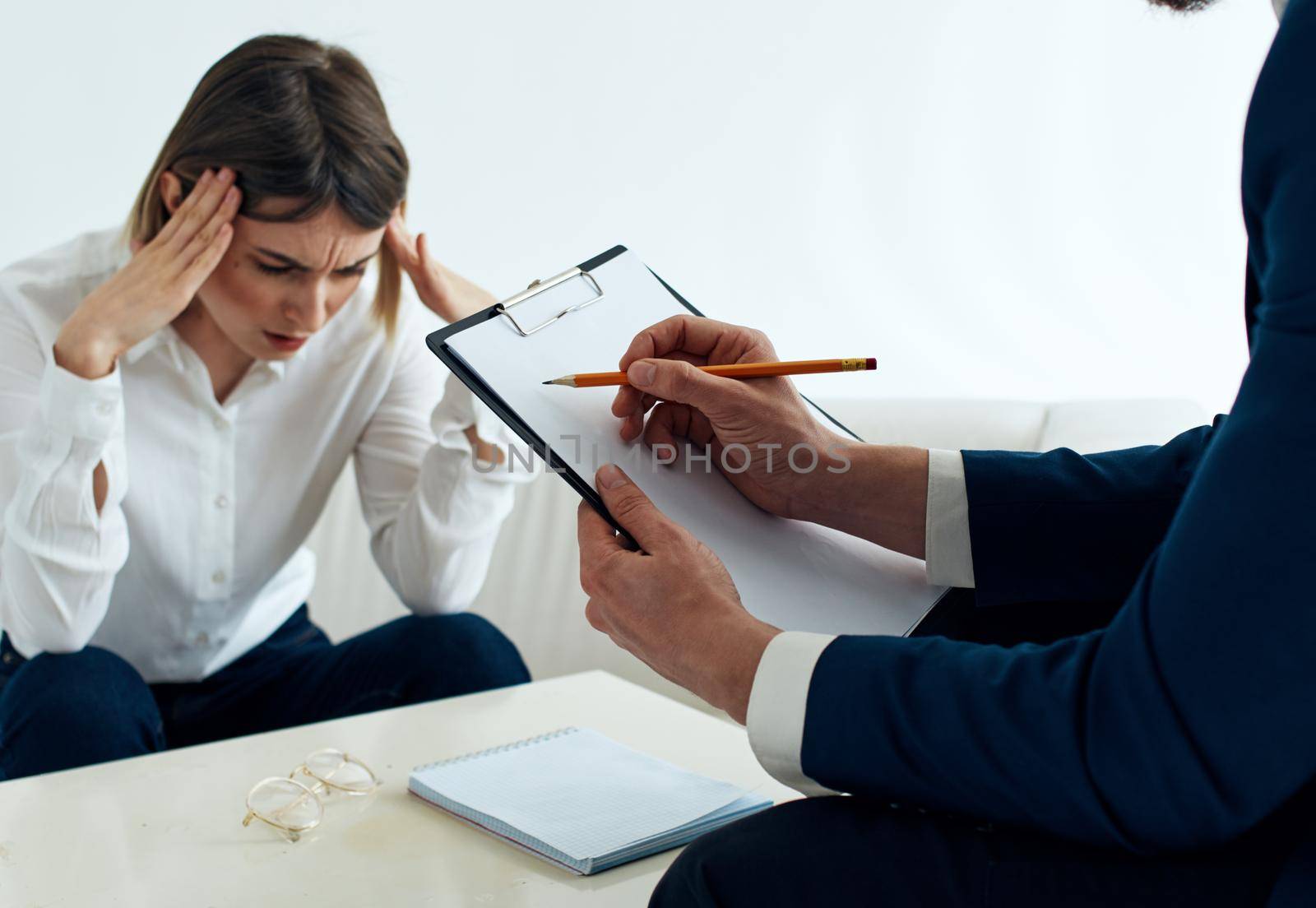 Employees men and women at the table communicating psychologist documents. High quality photo