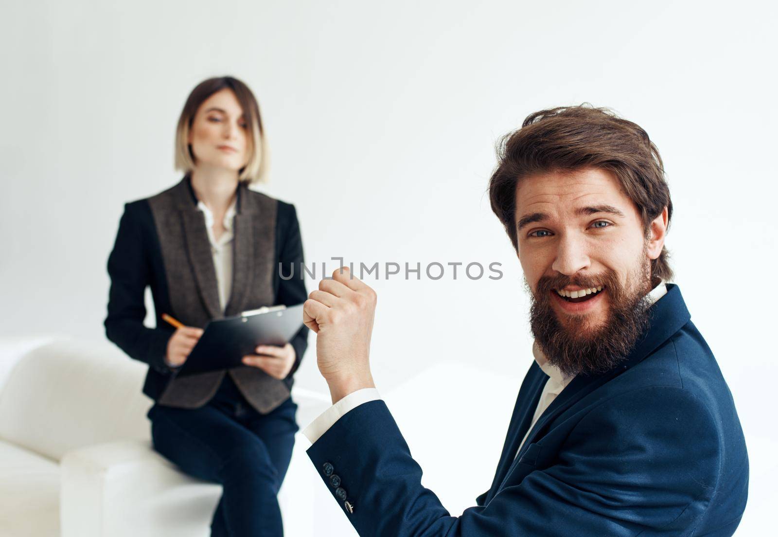 Emotional man and Business woman indoors hiring vacancies resume. High quality photo