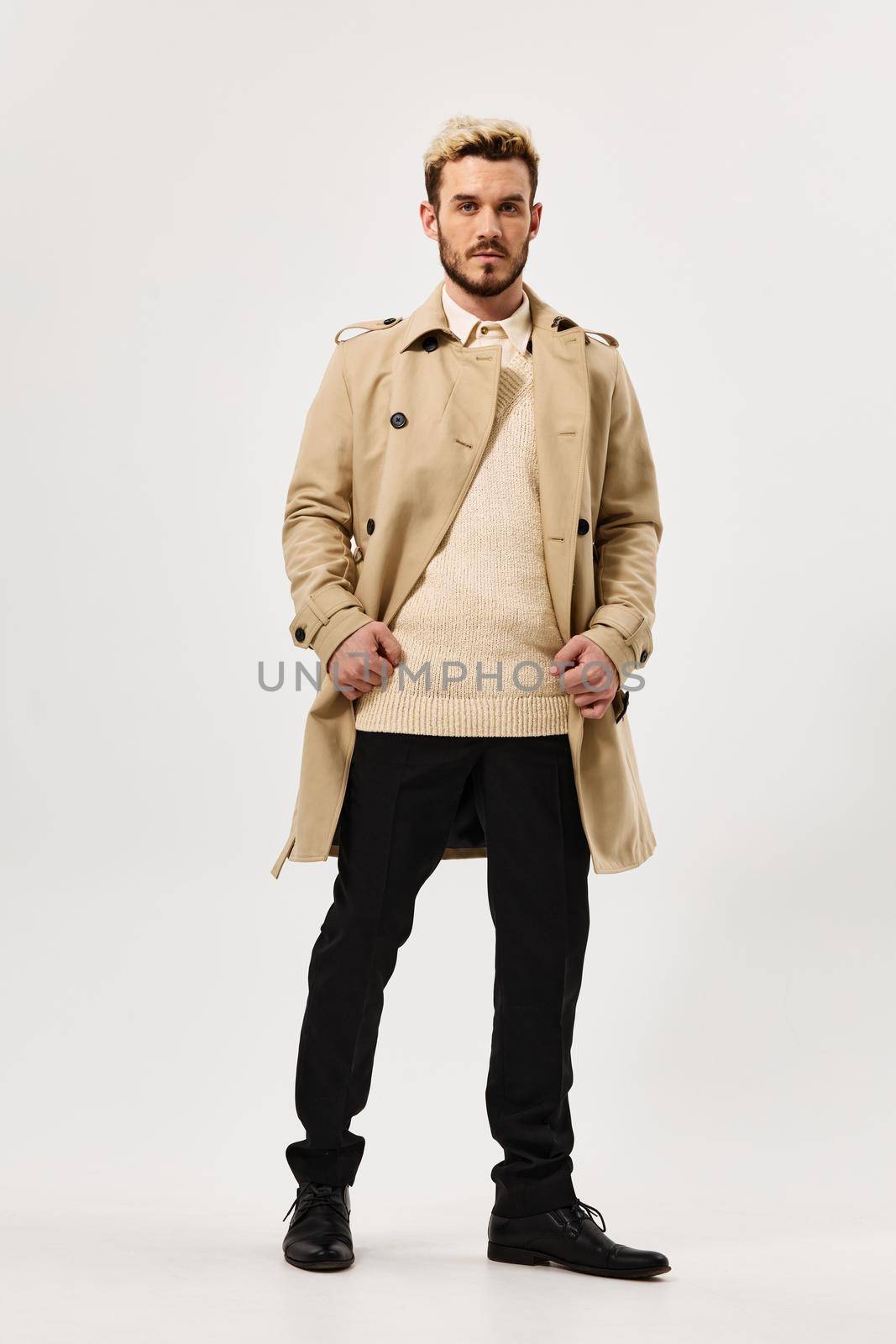 handsome man fashion hairstyle coat full length lifestyle. High quality photo