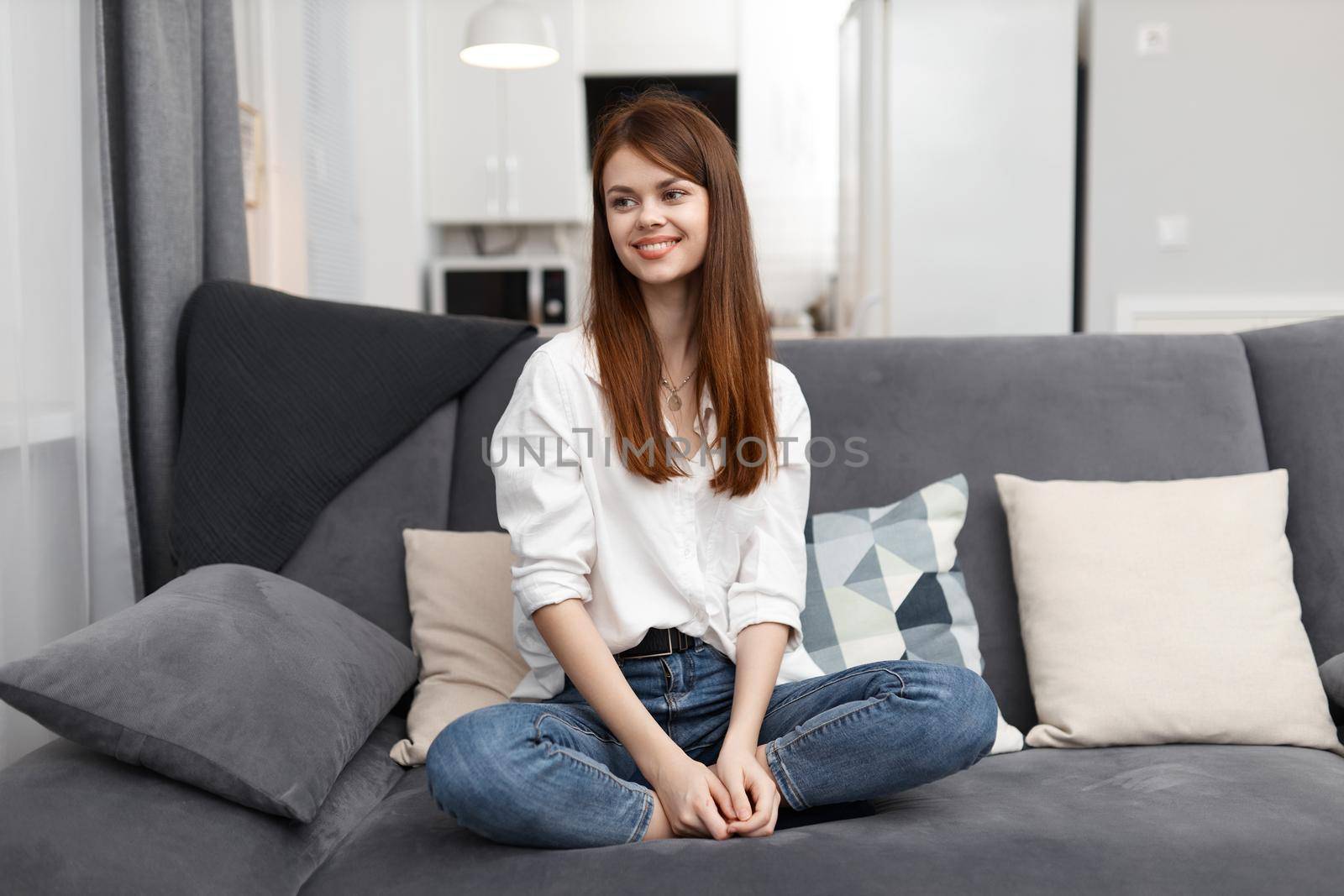 woman at home on the couch rest Comfort in the apartment. High quality photo