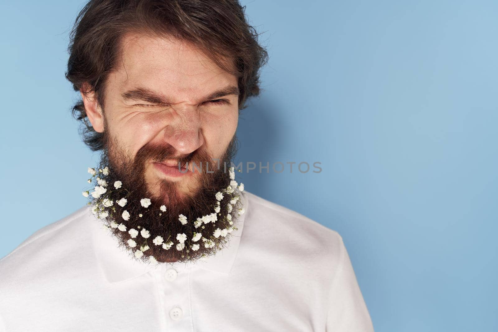 Cute man beard flowers decoration close-up isolated background. High quality photo