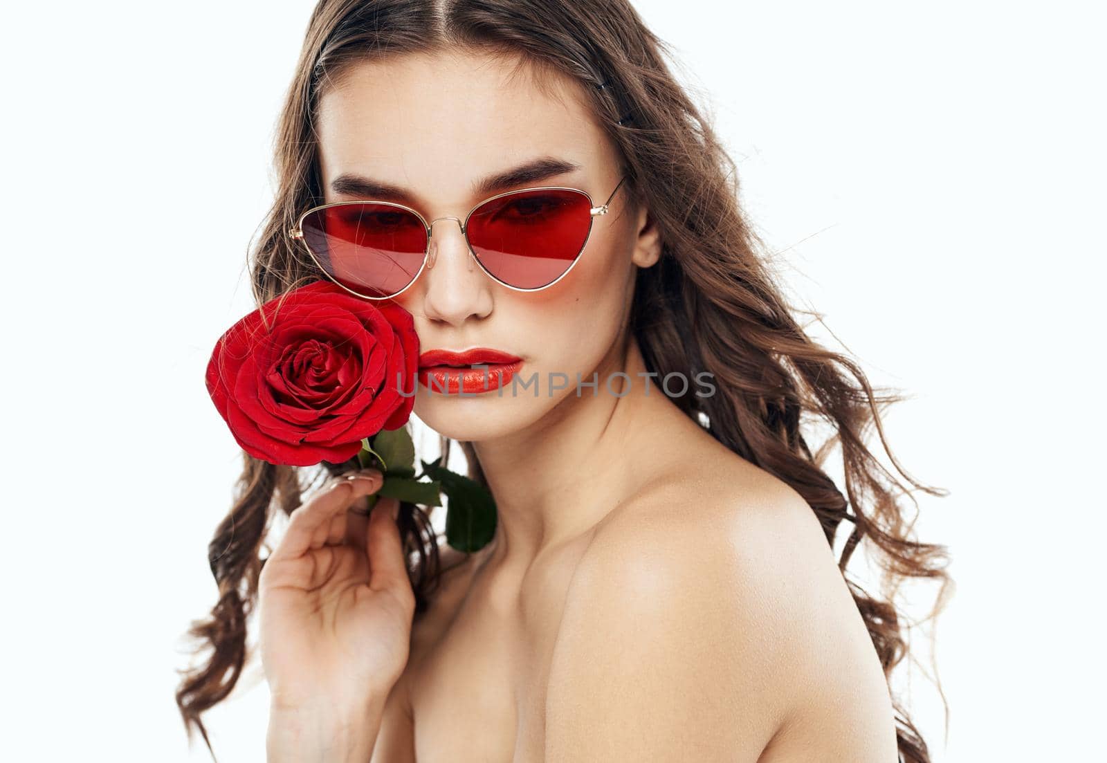 Charming woman with red rose brunette sunglasses. High quality photo