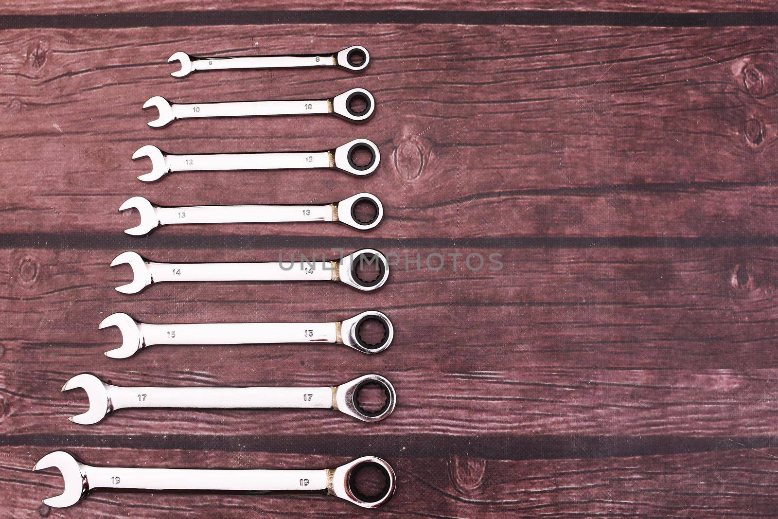 Combination wrenches for car repair. A set of tools with a ratchet. Top view.