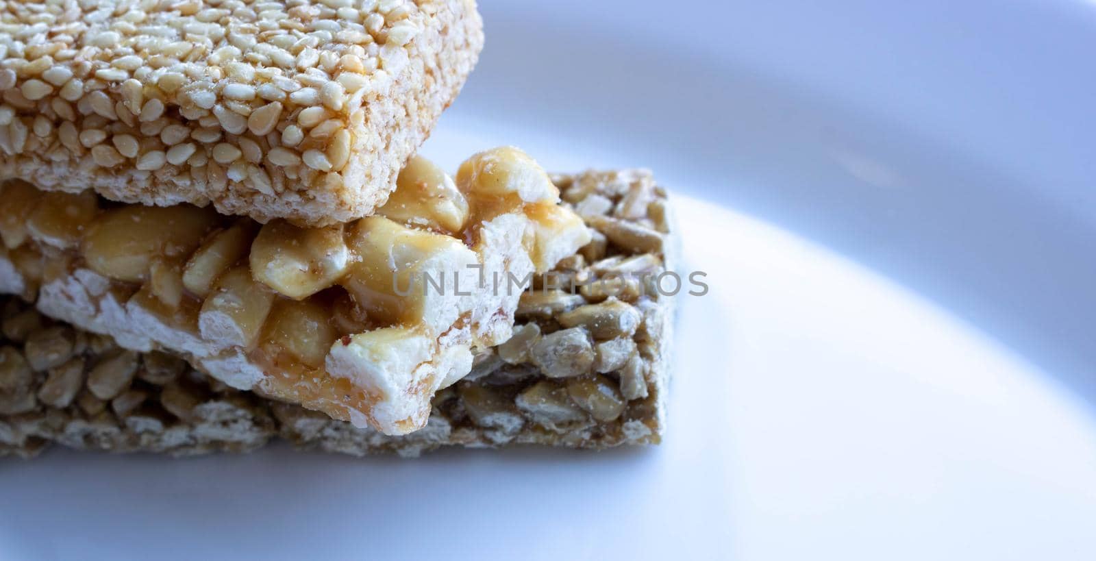 Delicious Honey kozinaki on a white plate.