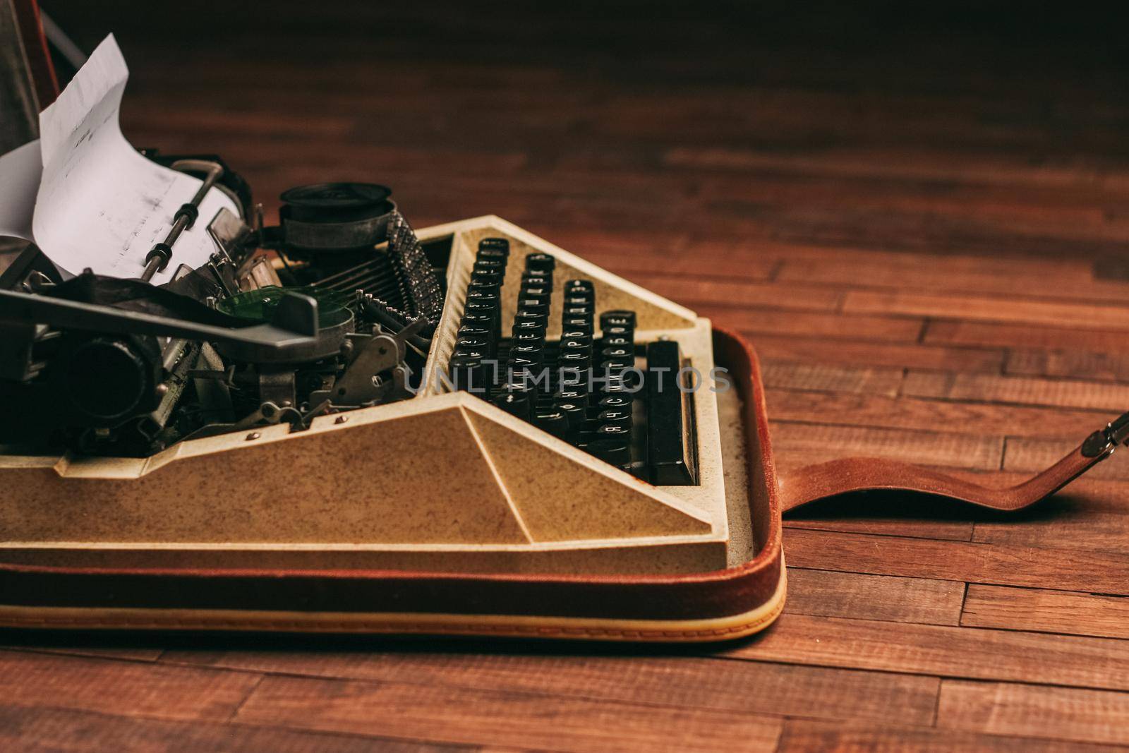 typewriter with keys on a wooden background retro style close-up macro by SHOTPRIME
