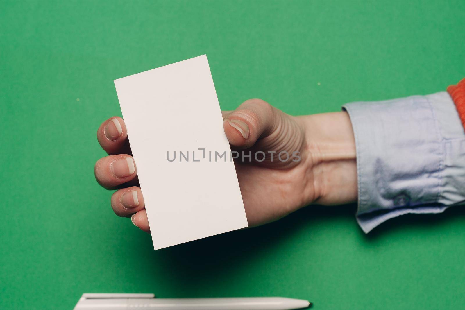 white business cards on bright background and ballpoint pen finance mockups. High quality photo