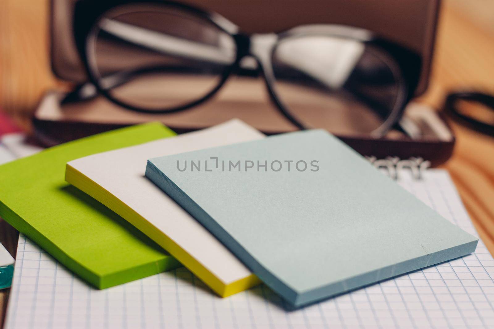 notepads felt-tip pens stationery glasses in case office. High quality photo
