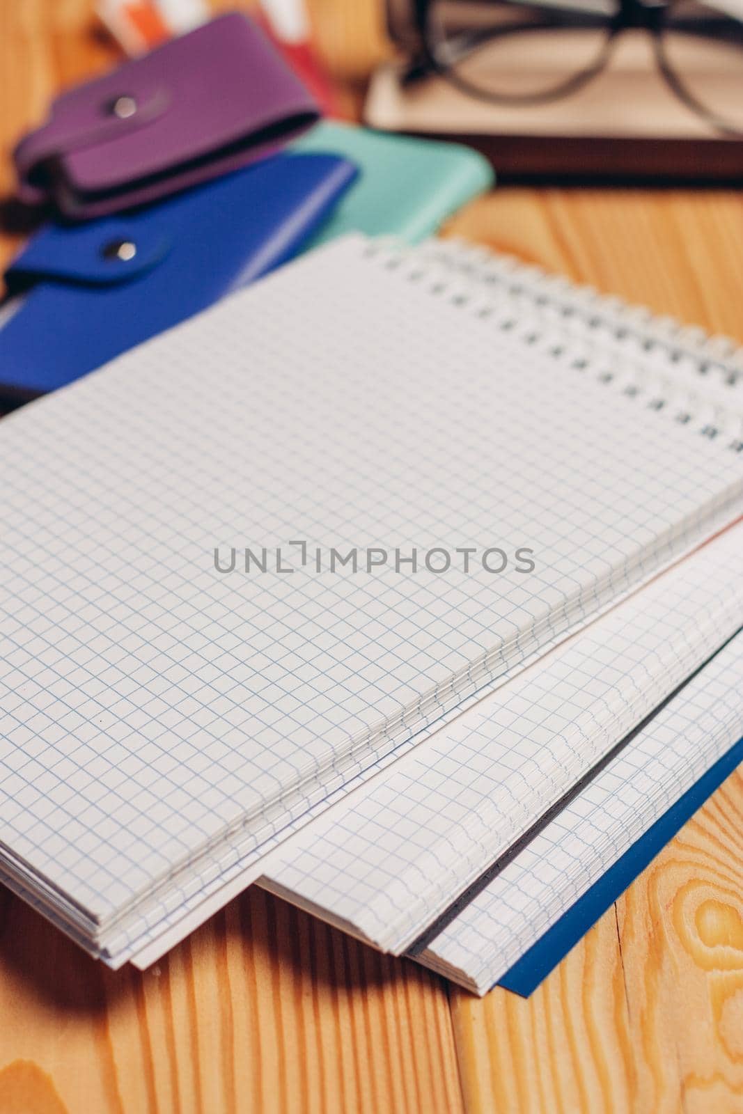 notepads pencils office work paper wood background by SHOTPRIME