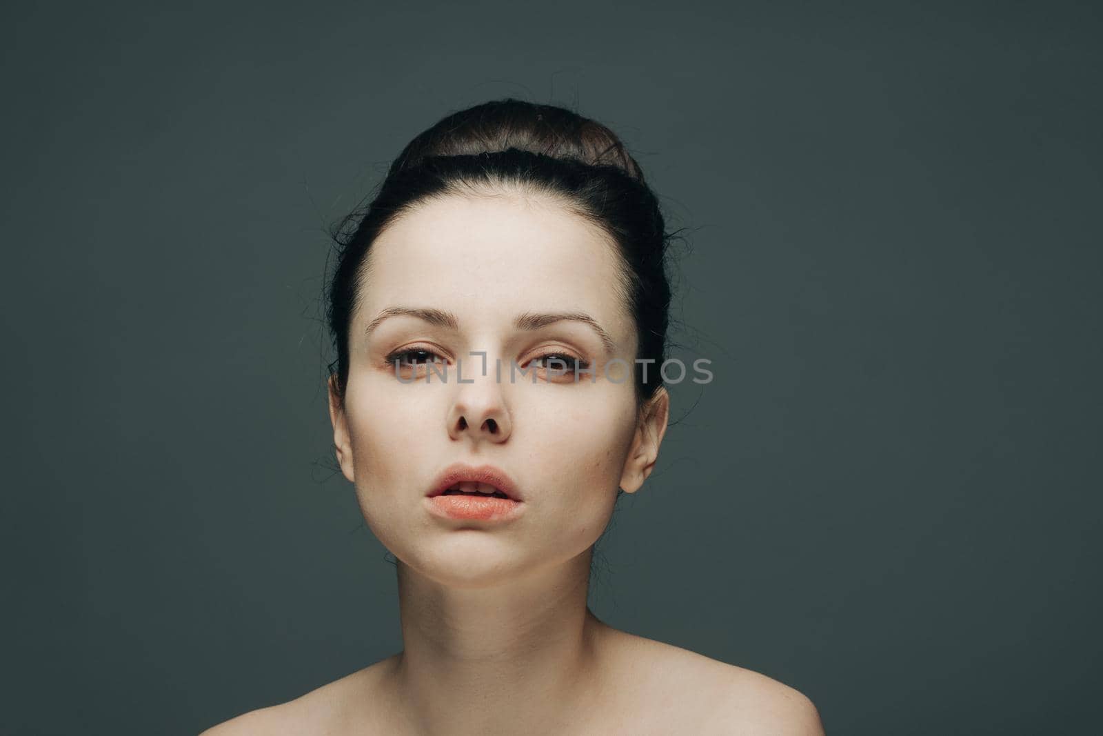 brunette with bare shoulders gathered hair glamor close-up by SHOTPRIME