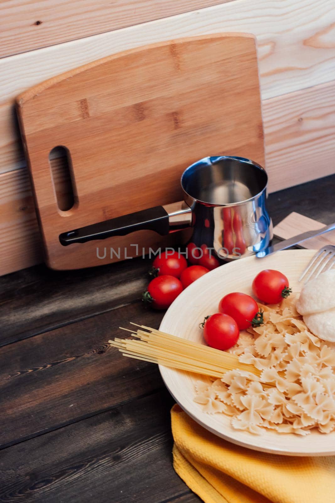 ingredients for cooking lunch italian cuisine pasta cherry tomatoes. High quality photo