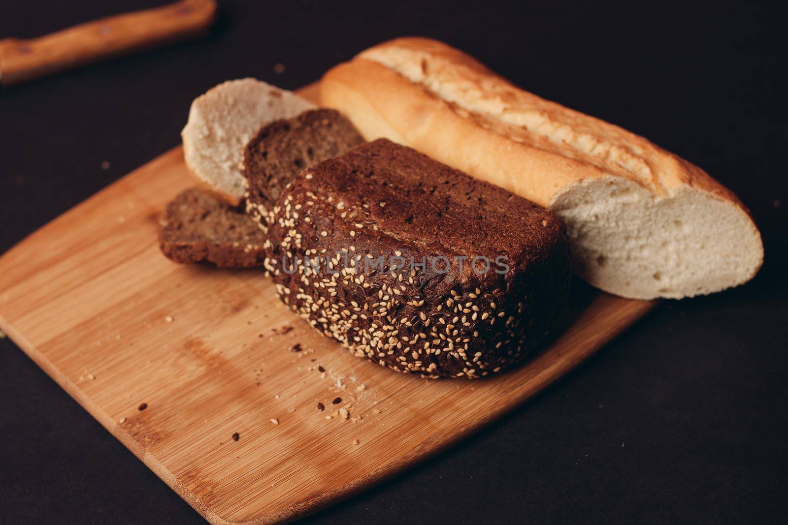 flour products on a wooden board baking loaf of bread. High quality photo