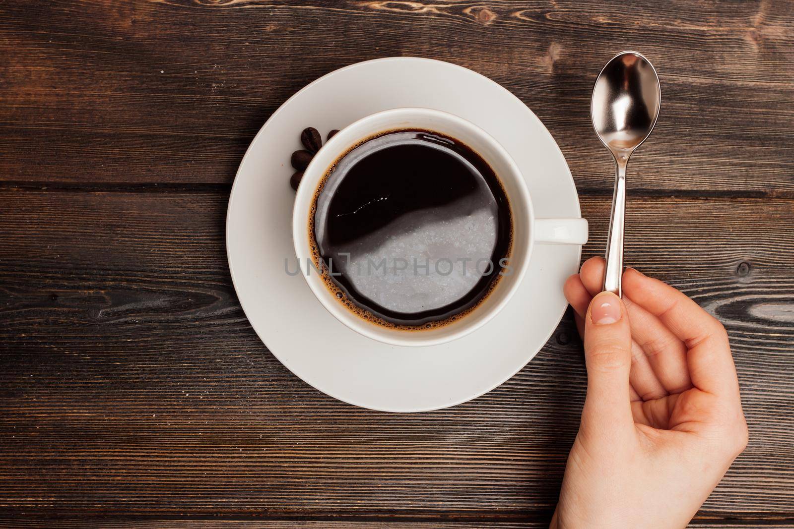 a cup of coffee on a wooden table breakfast relaxation energy. High quality photo