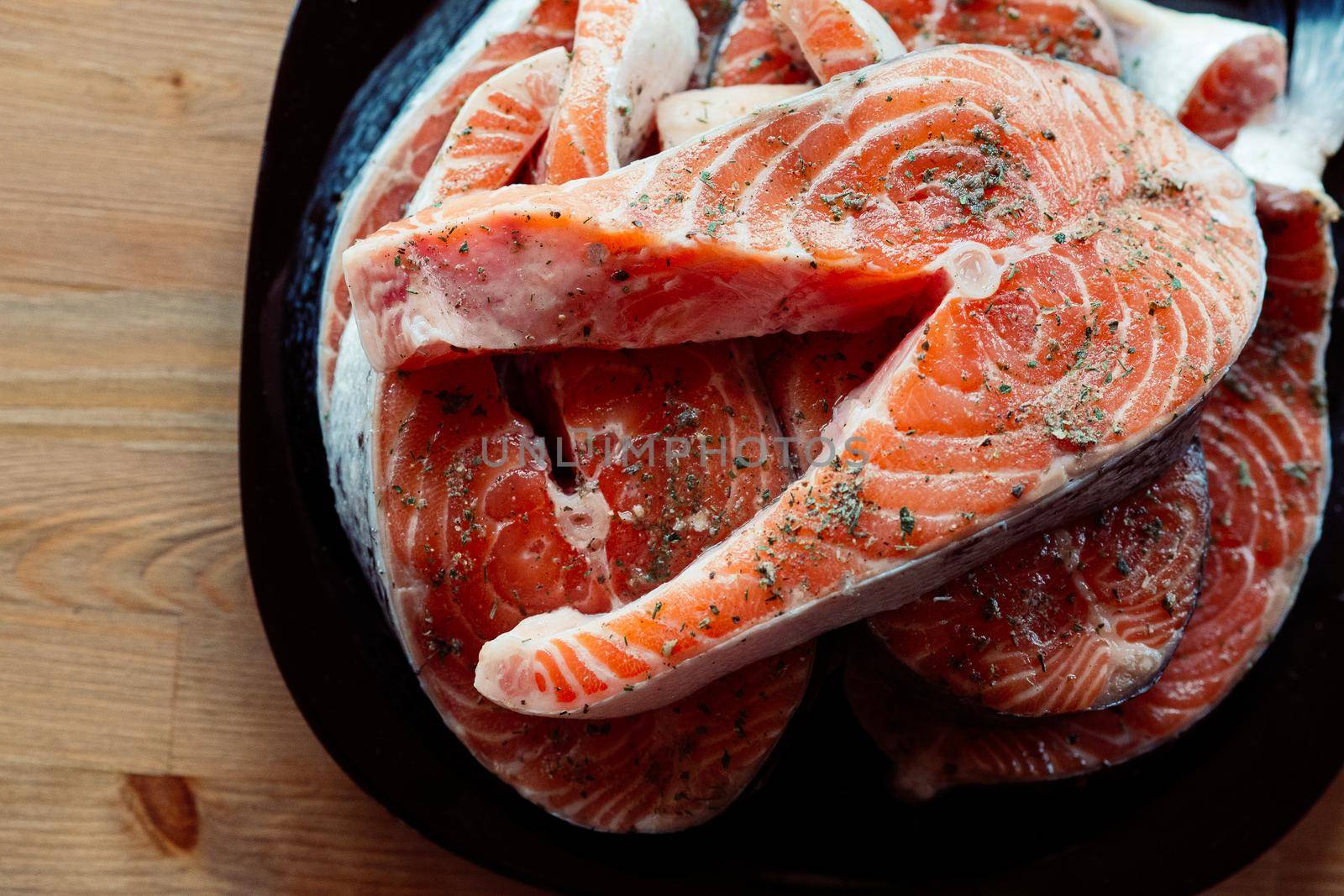 red fish on a plate steaks marinated in spices sea food. High quality photo