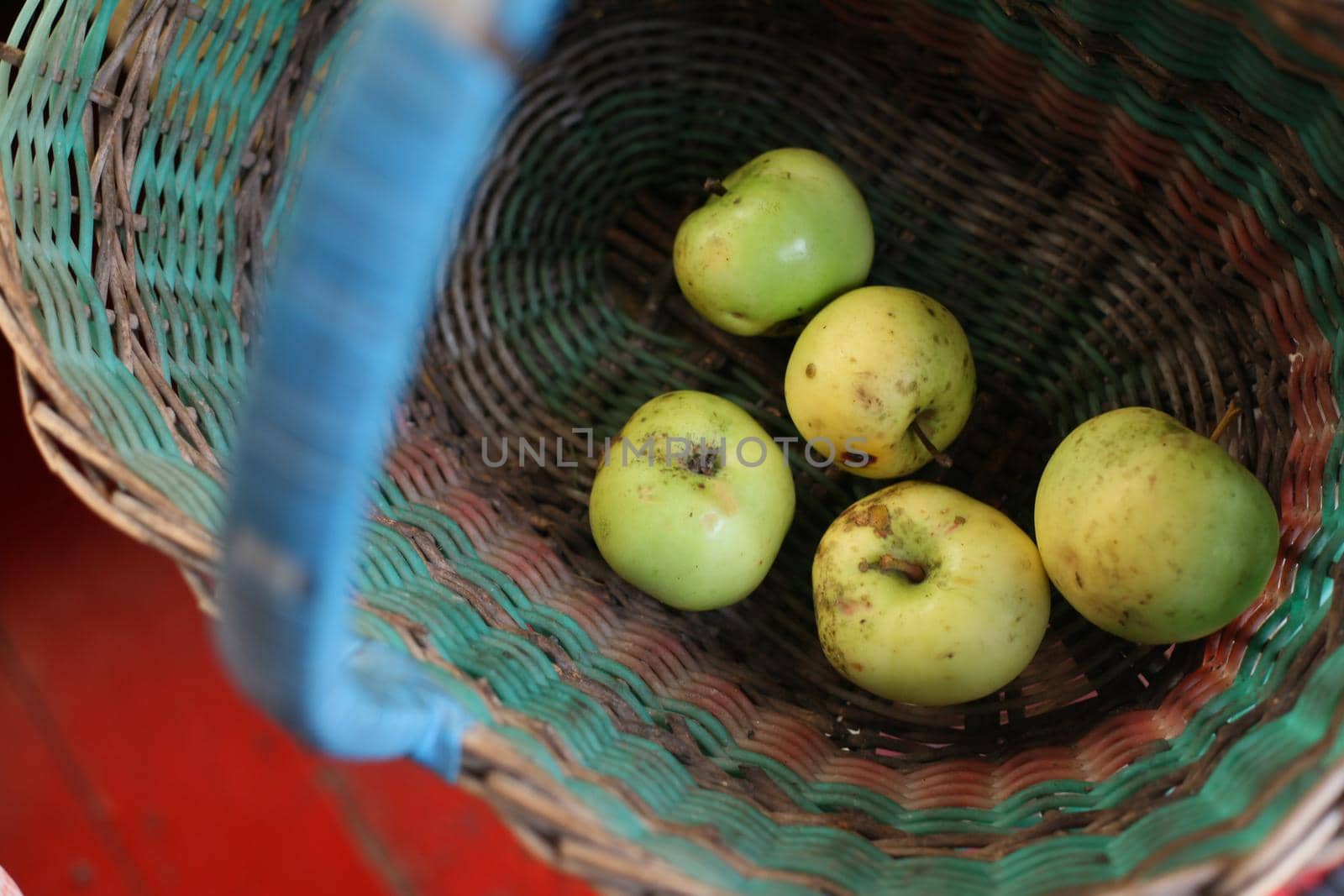 Village apples in a basket, top view by Olga26