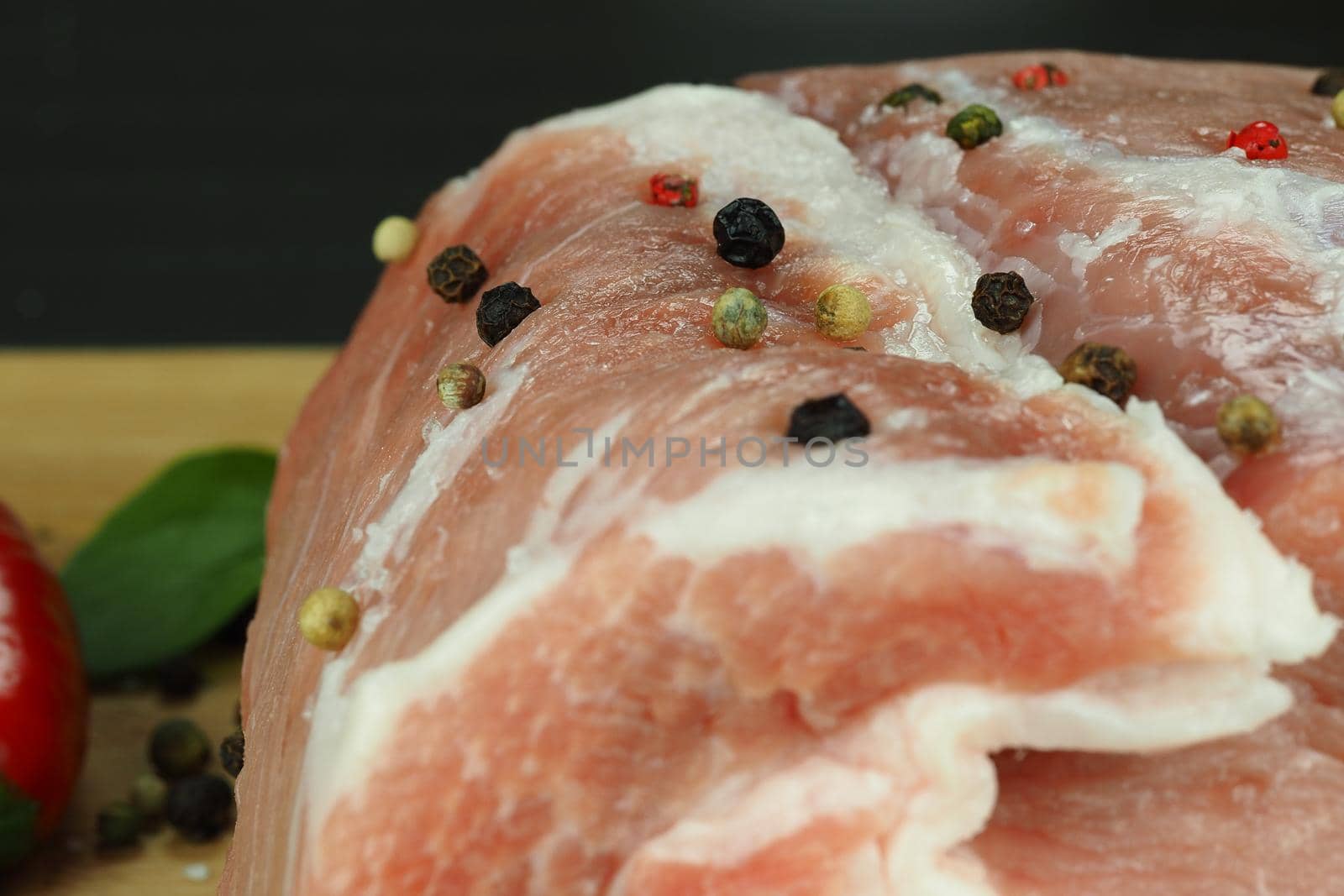 Fresh raw meat with spices. A big beautiful piece. High quality photo