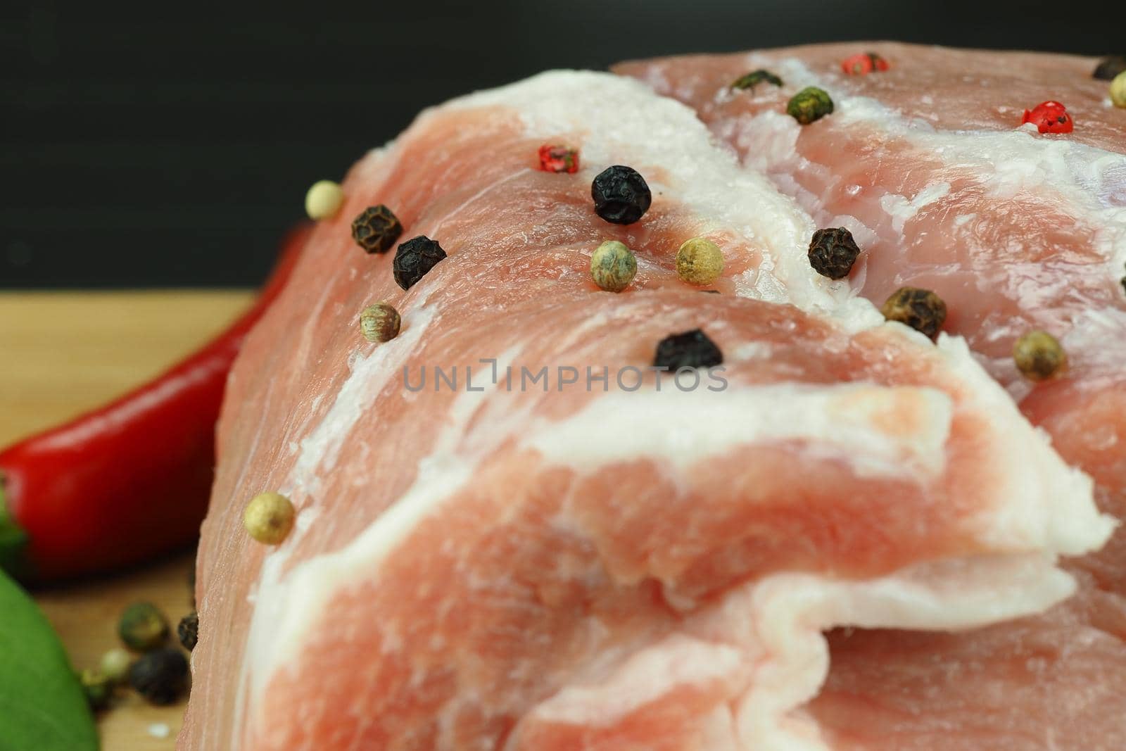 Fresh raw meat with spices. A big beautiful piece. High quality photo