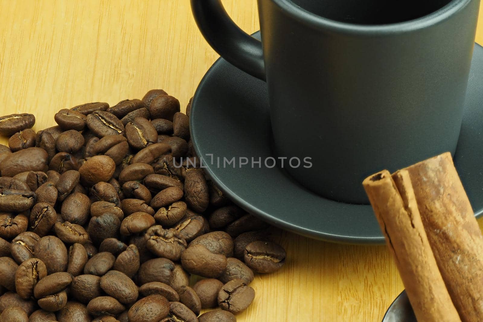 Beautiful background and coffee beans and a coffee cup in the background. High quality photo