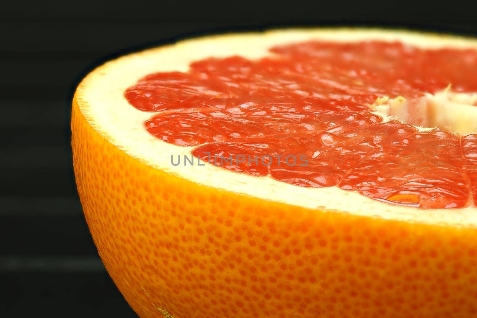 Juicy citrus fruits. Grapefruit, cut. It's a macro- by Olga26