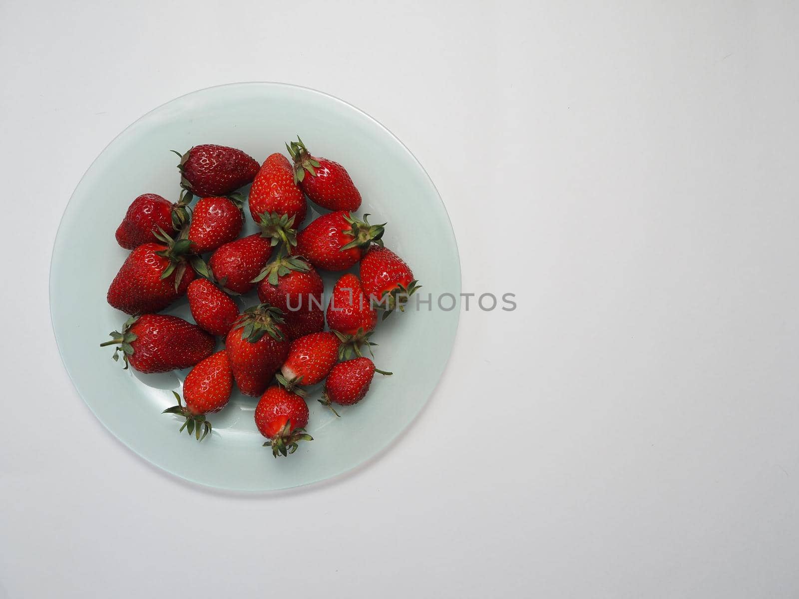 Ripe strawberries. Ripe red berries on a platter. by Olga26