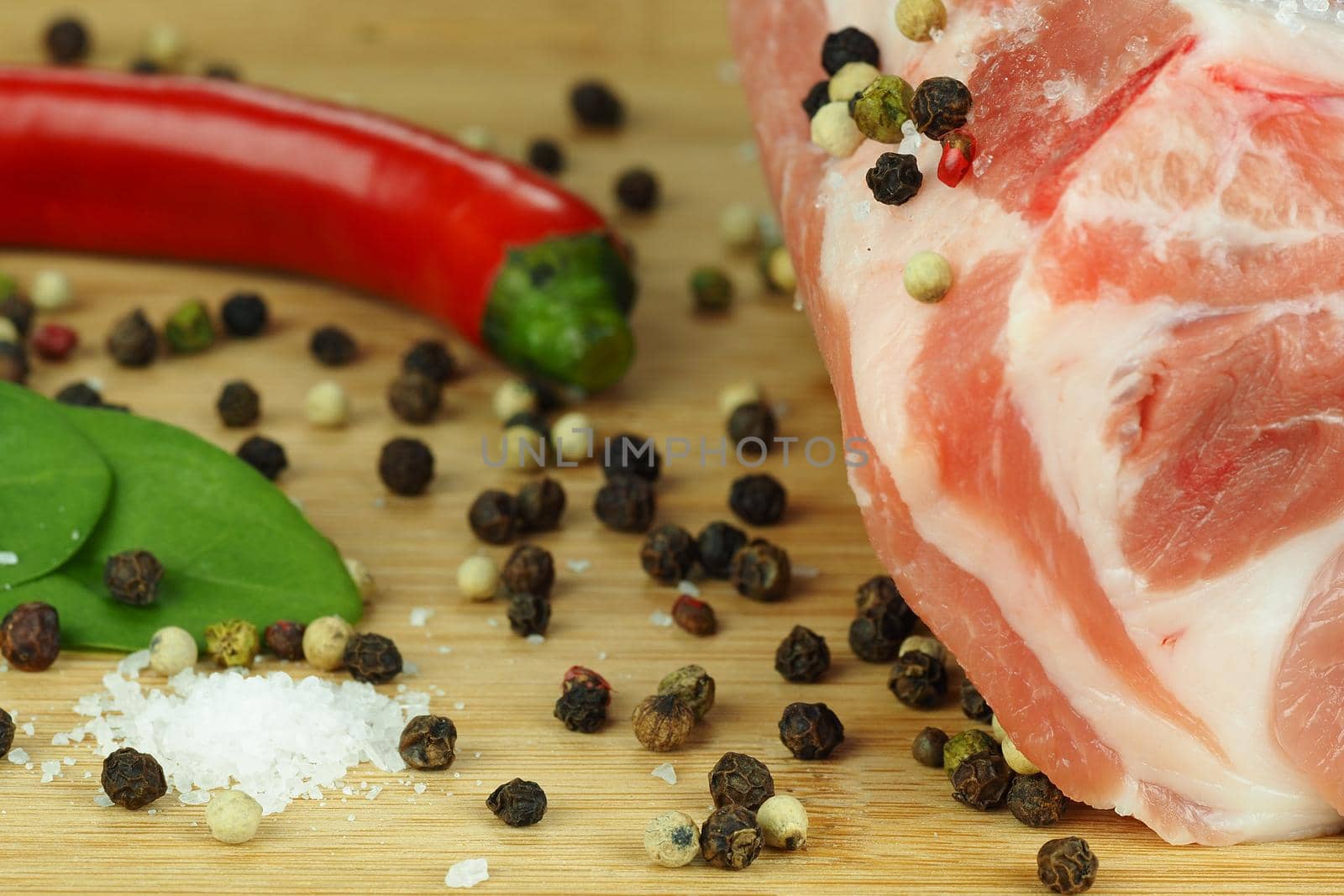 Fresh raw meat with spices. A big beautiful piece. High quality photo