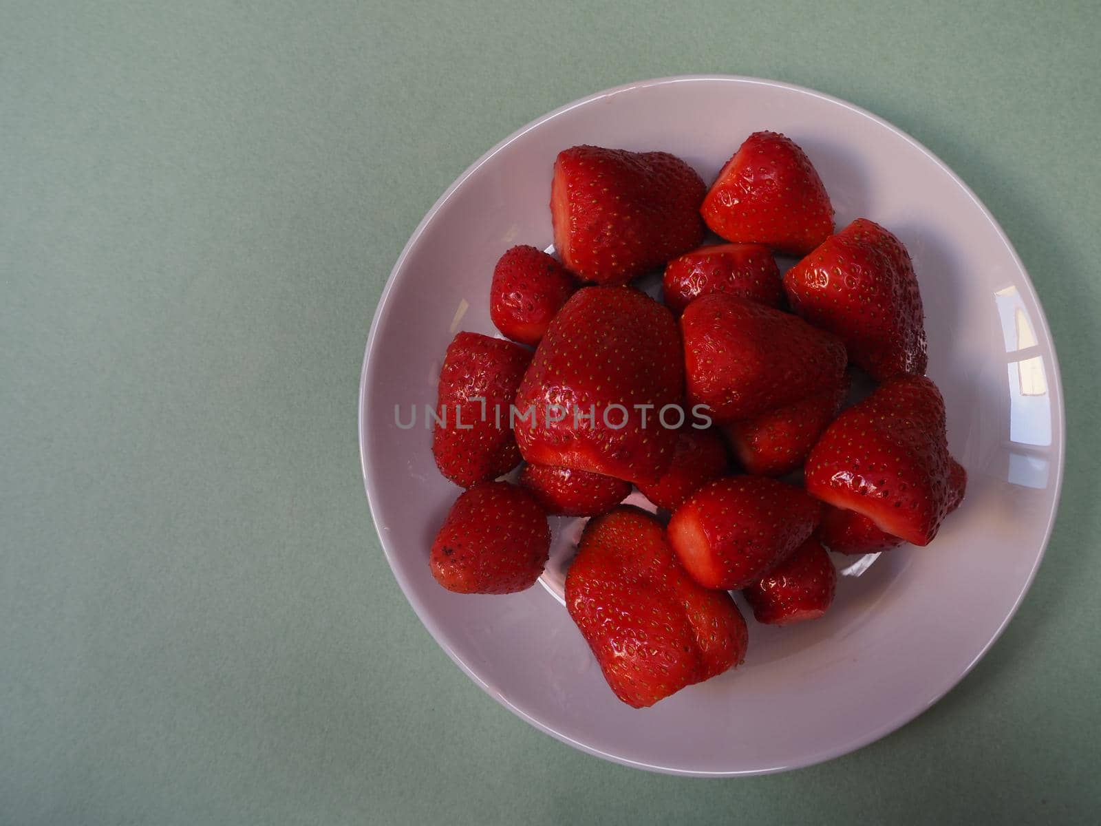 Ripe strawberries. Ripe red berries on a platter. by Olga26