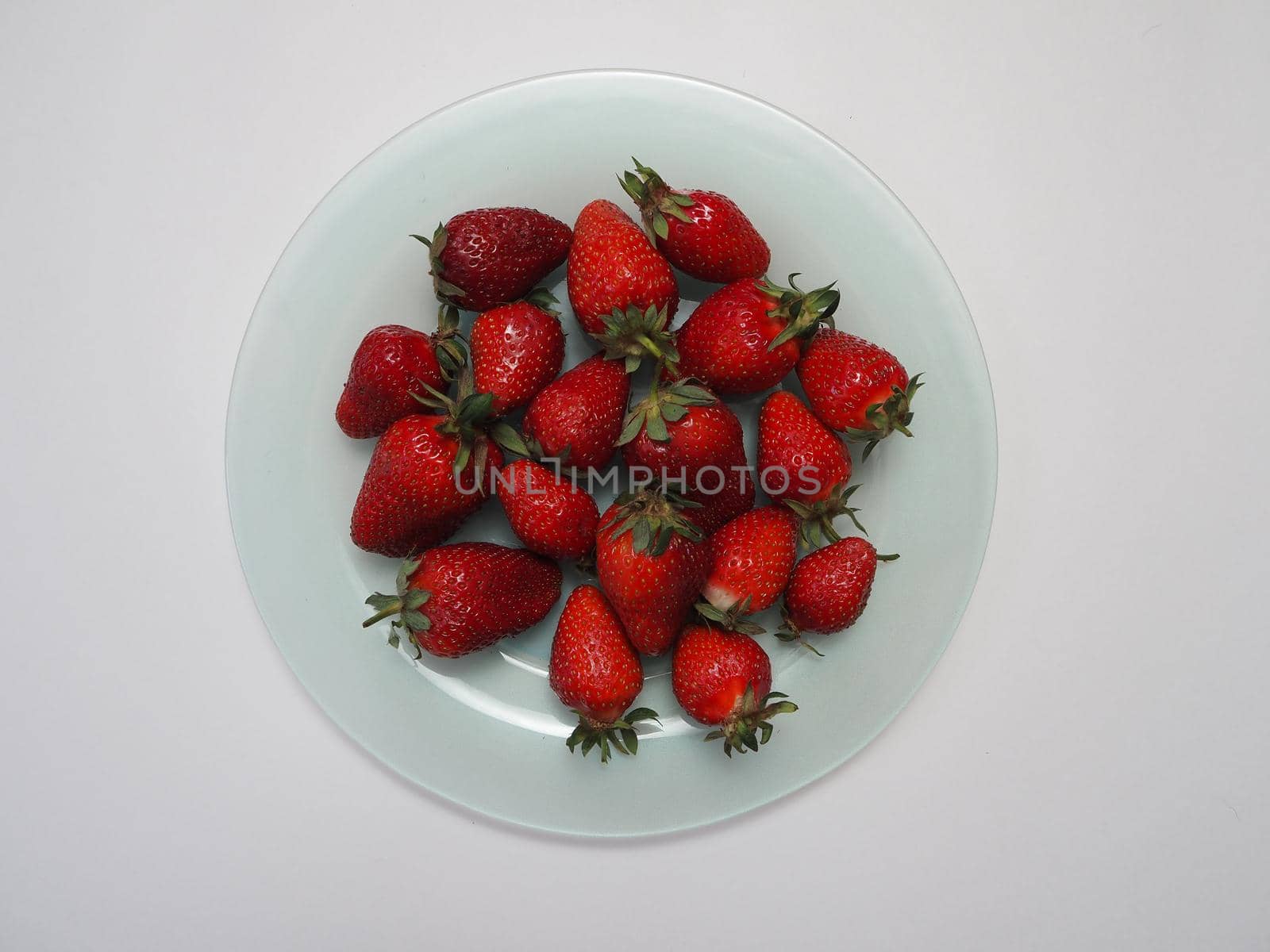 Ripe strawberries. Ripe red berries on a platter. by Olga26