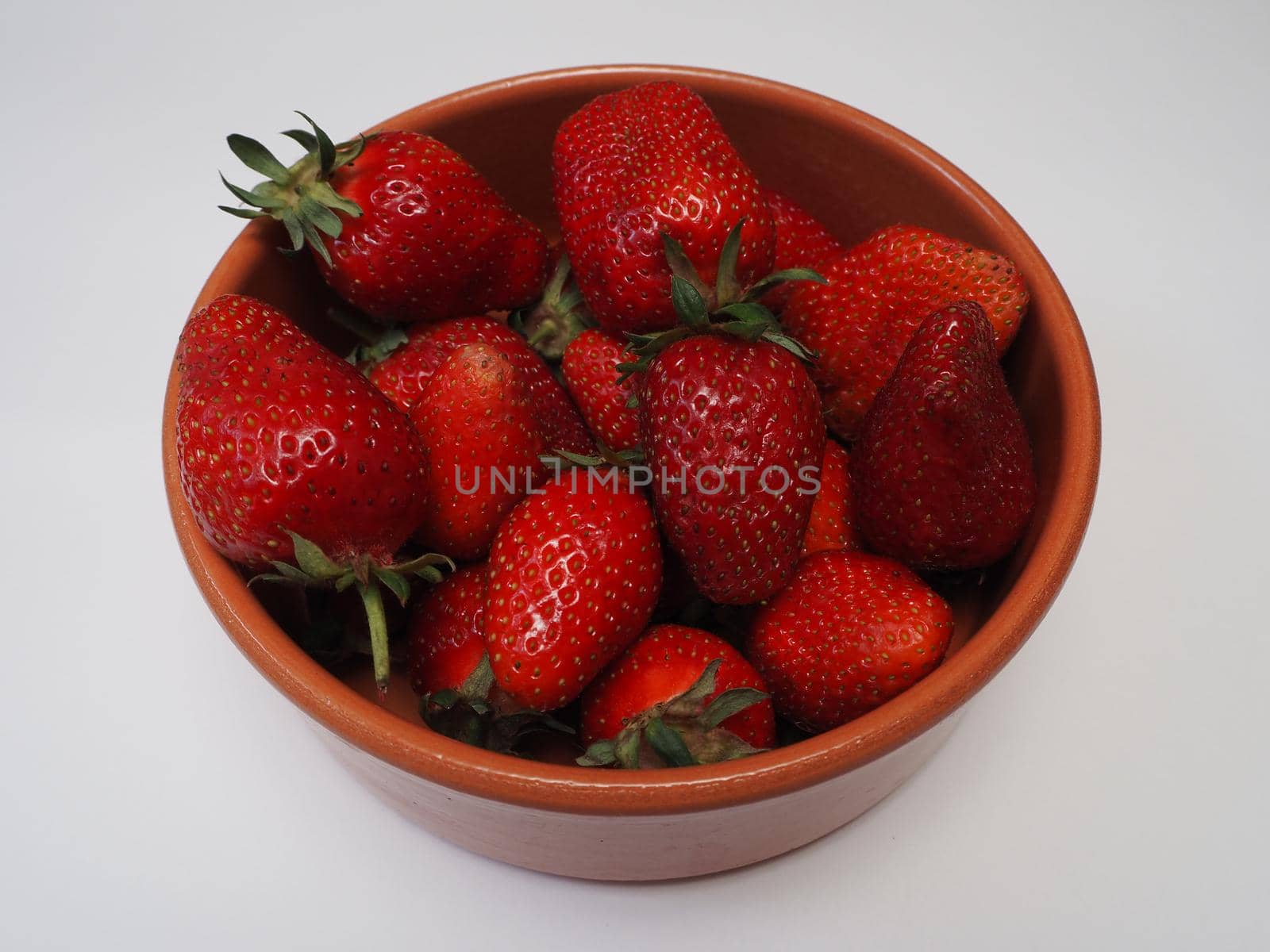 Ripe strawberries. Ripe red berries on a platter. by Olga26