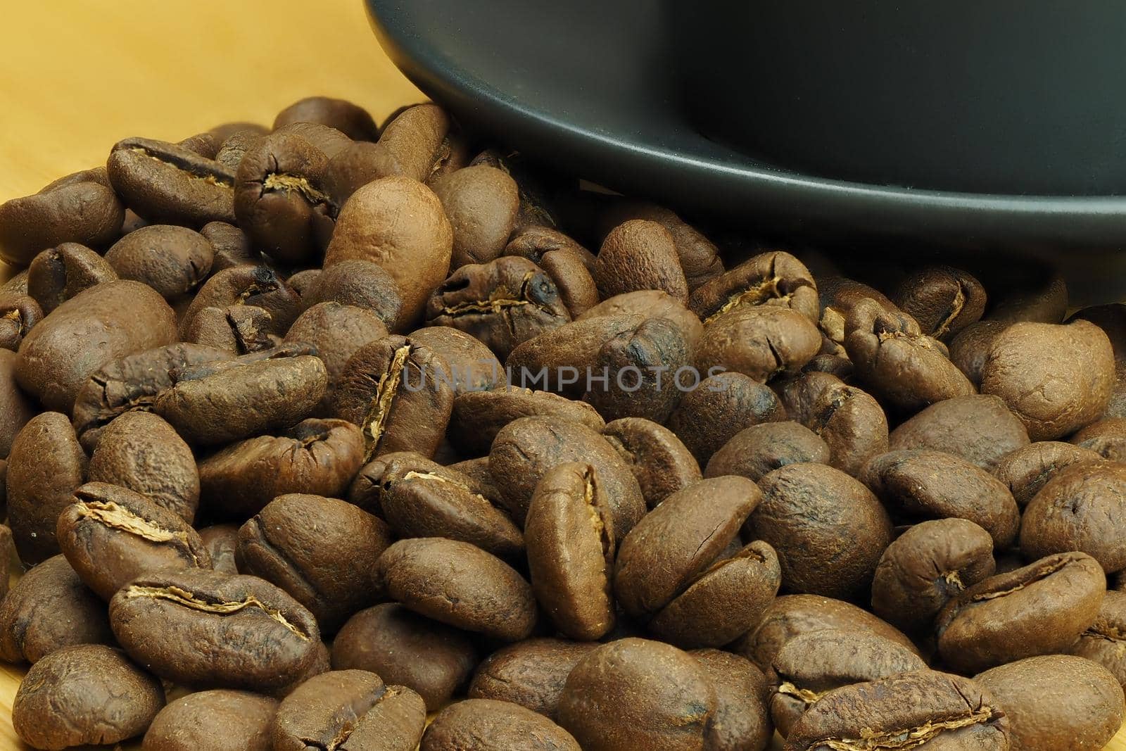 Beautiful background and coffee beans and a coffee cup in the background. High quality photo