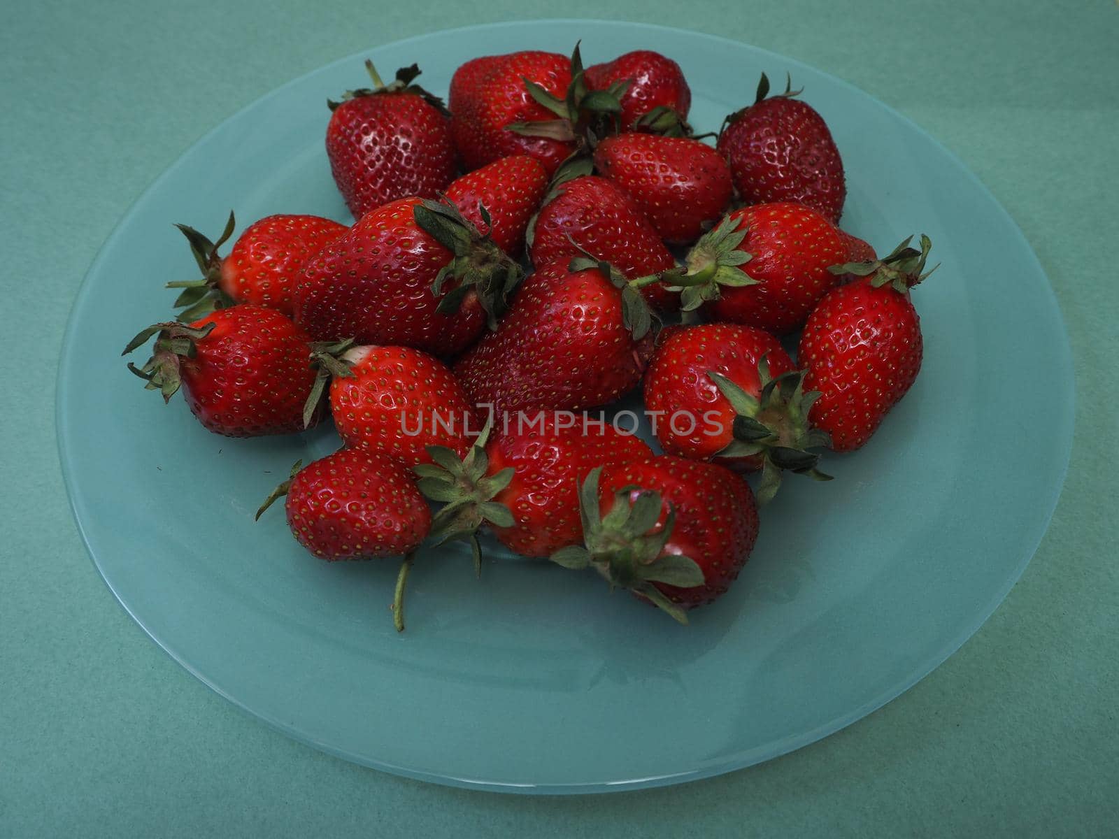 Ripe strawberries. Ripe red berries on a platter. High quality photo