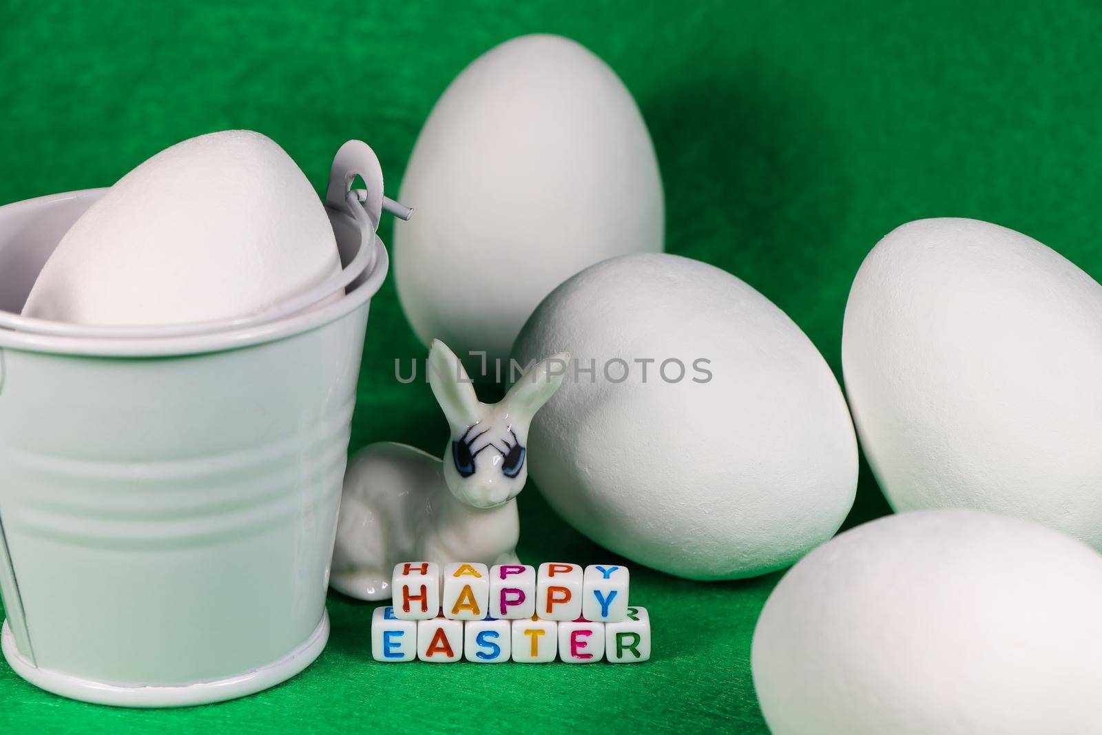 Happy Easter Bunny With Large White Eggs And Bucket by jjvanginkel