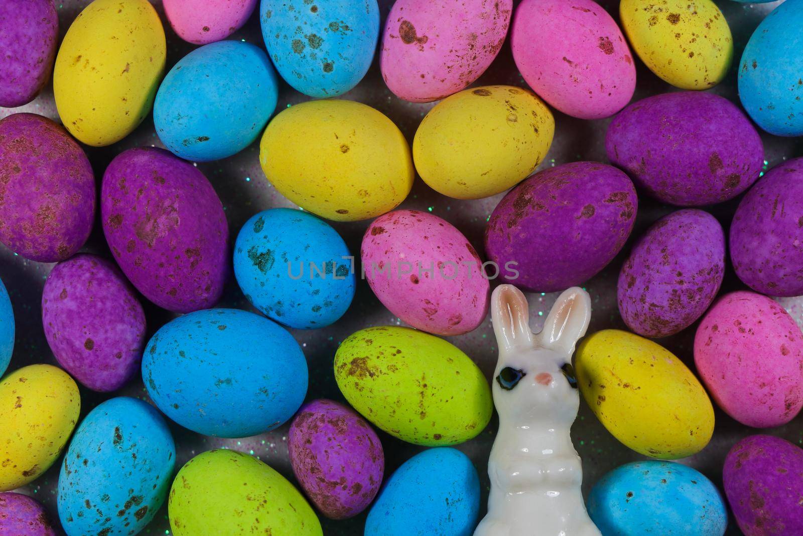 Easter bunny with colorful speckled candy eggs fill layout