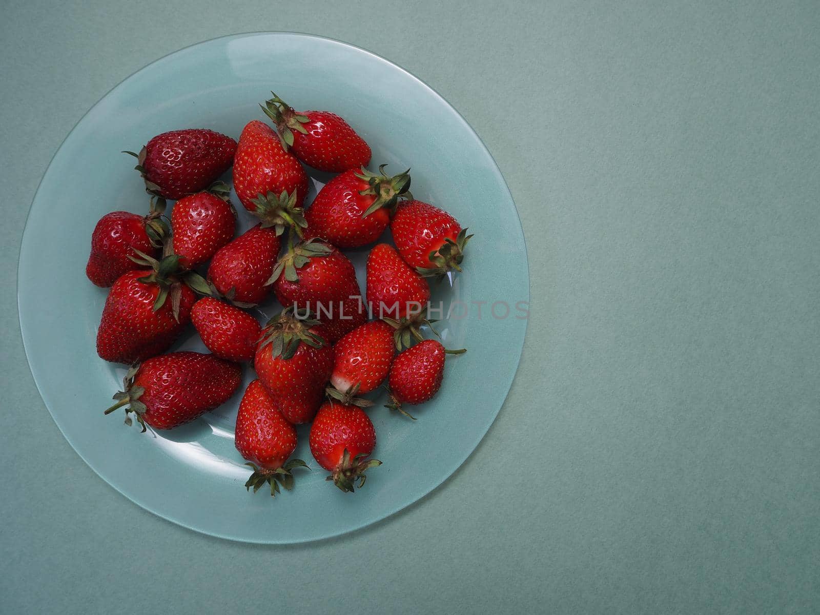 Ripe strawberries. Ripe red berries on a platter. by Olga26