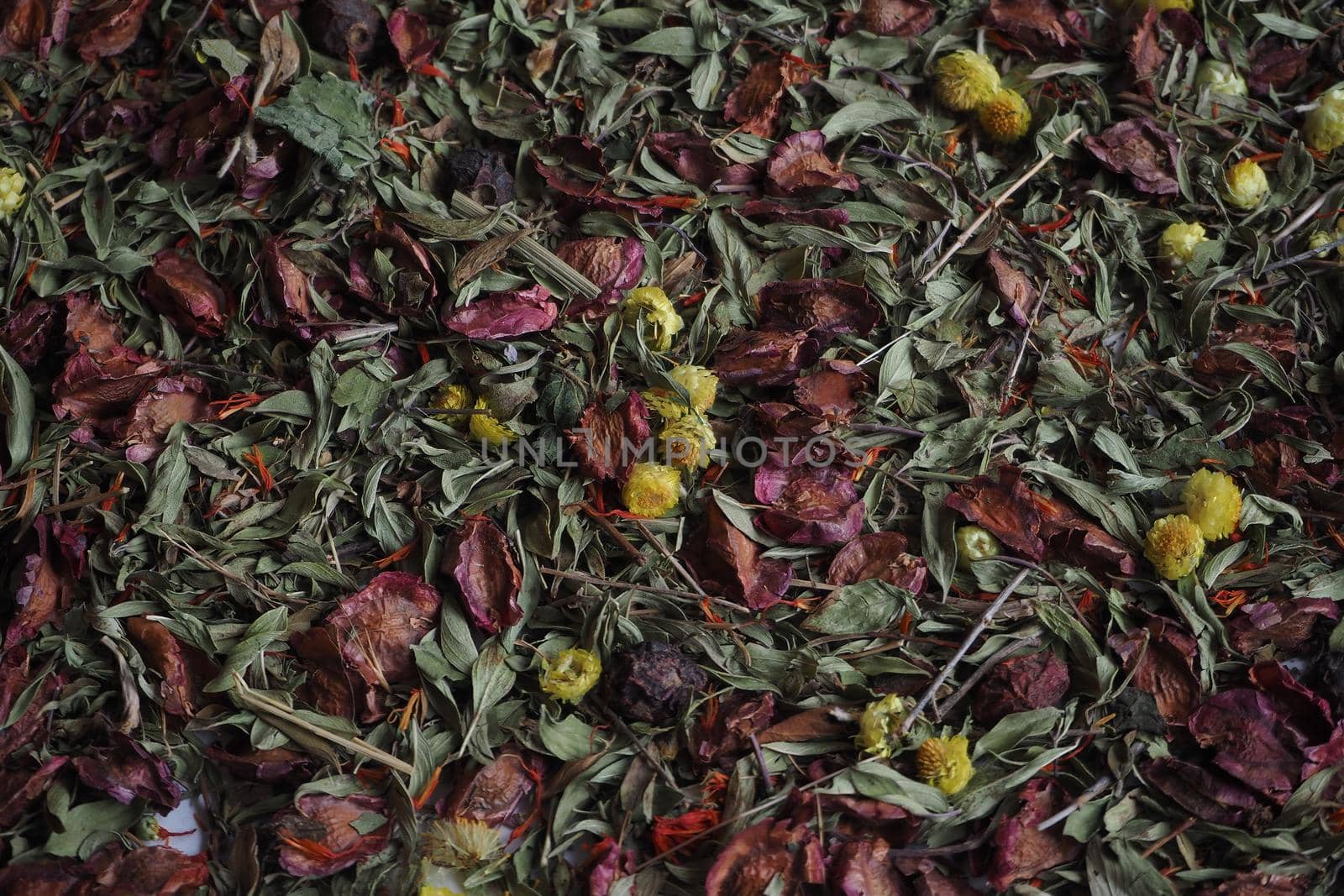 A beautiful background of dried herbs and flowers. Dark tones.