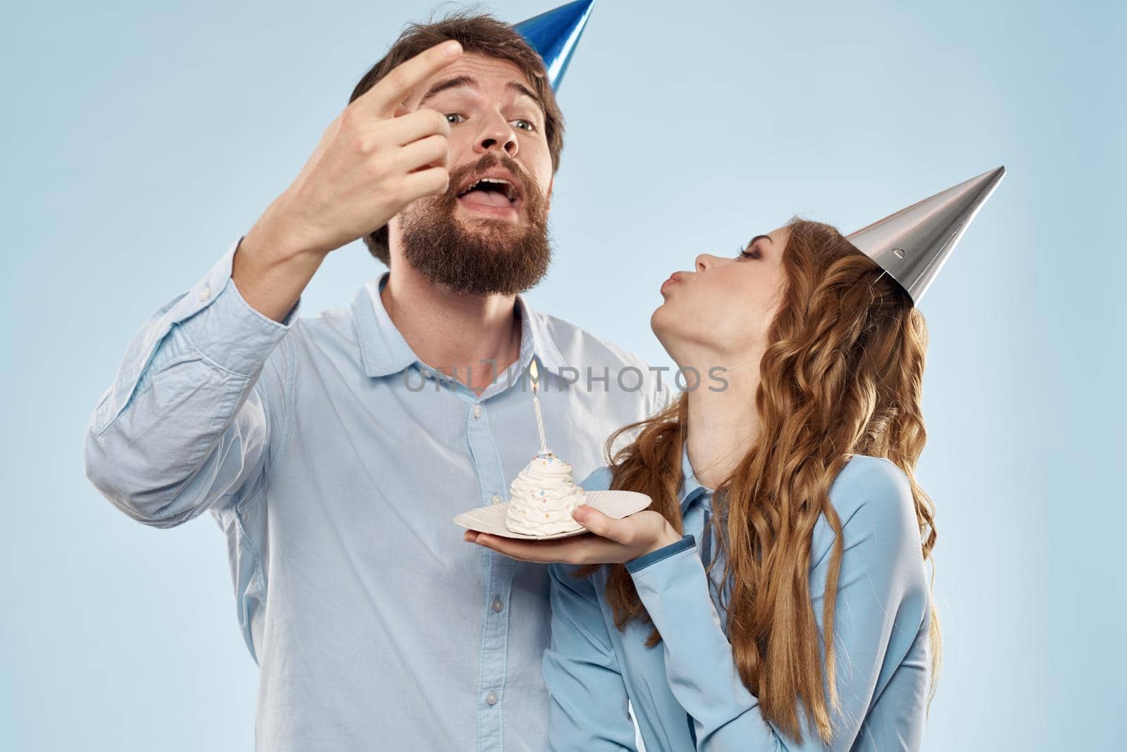 Birthday cake with candle man and woman corporate party fun holidays. High quality photo