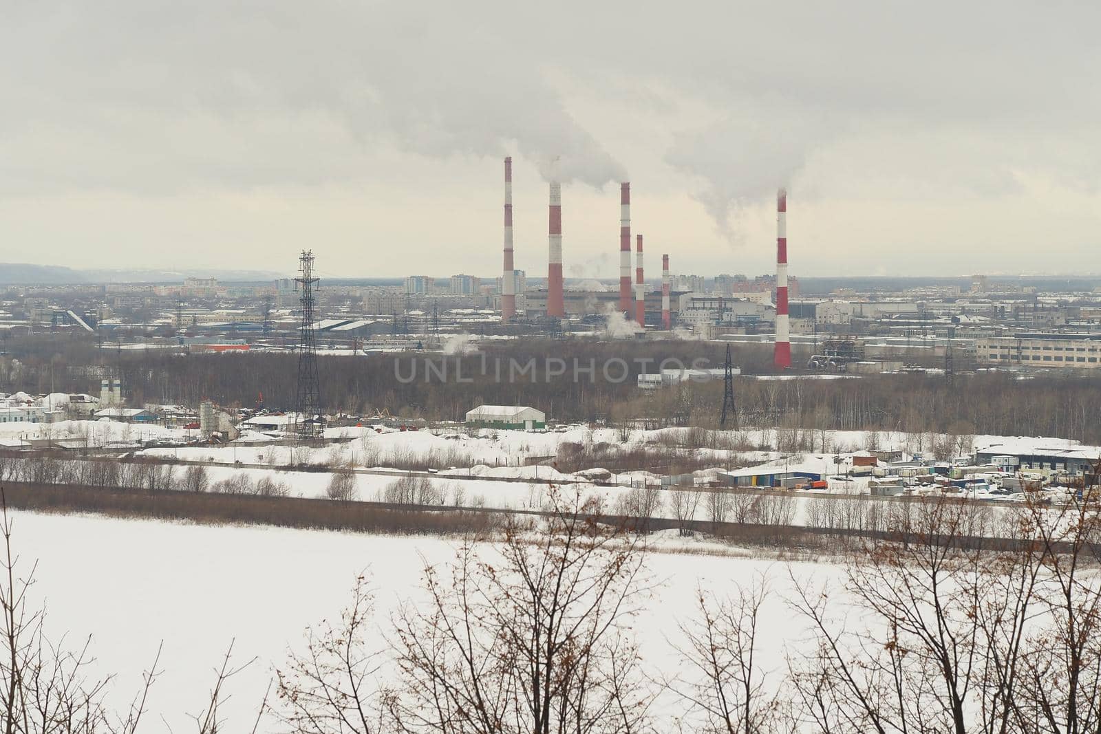 Industrial city by the river in winter. The infrastructure of the port metropolis, factories, factor by Olga26