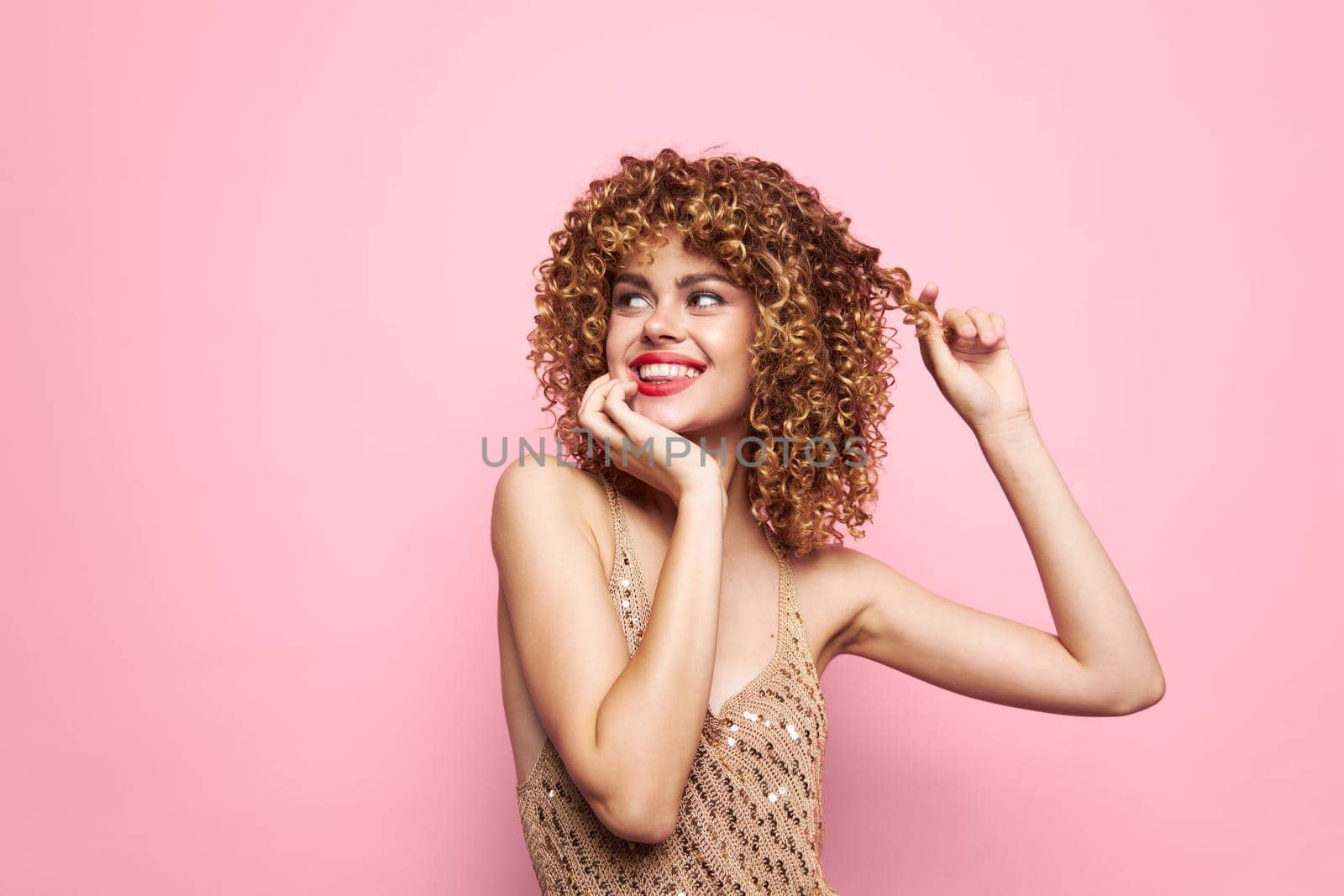 Female Happy holidays smile curls portrait sequin shirt pink isolated background