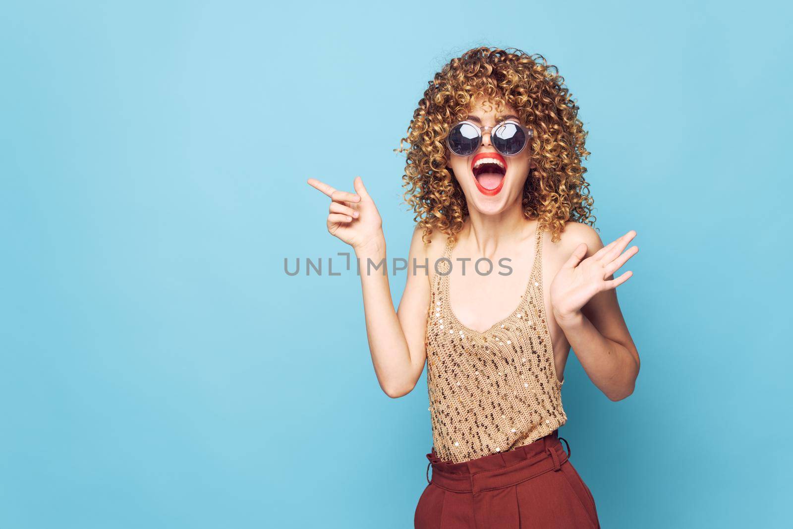 Charming model With his wide open mouth dark glasses gesturing with his hands Copy Space by SHOTPRIME